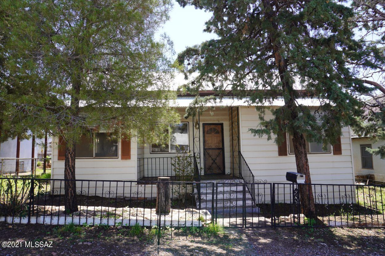 Cute home on nice shady lot. Beautiful front yard and entry. Home renovation has been started. You will need to finish it. Home has 2 bedroom plus an sunny office, good size dining room, living room and kitchen. Also has back porch which has a closet and can be a 3rd bedroom. Bathroom has been wonderfully renovated with tub and shower. Beautiful tile work and new vanity and toilet. Some electrical renovation has been started including a new service. 125Amps. Roof is metal. Cute back porch with lemon tree just outside. One small storage shed for yard tools plus a larger storage building which appears to have been a guest house on one side with storage on the other. This home has textured aluminum siding with cute window awnings. BONUS-SQ FT does not incl. Back porch and guest room in back.