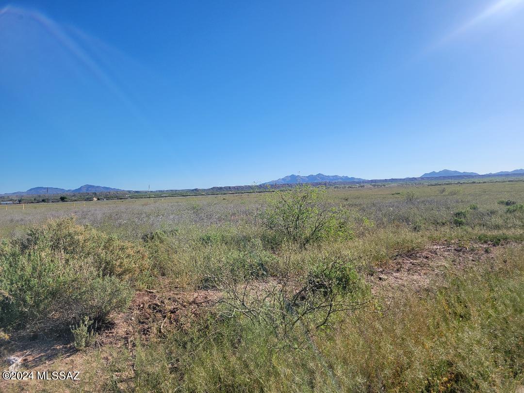 Paved road frontage just minutes to I-10 and Benson business district.  Level, partially fenced.  Electric on the west side of Pomerene .   Pomerene Water Company at property line.   Perfect home site for site built or manufactured home!  Mountain views !
No HOA  and No Deed Restrictions !
