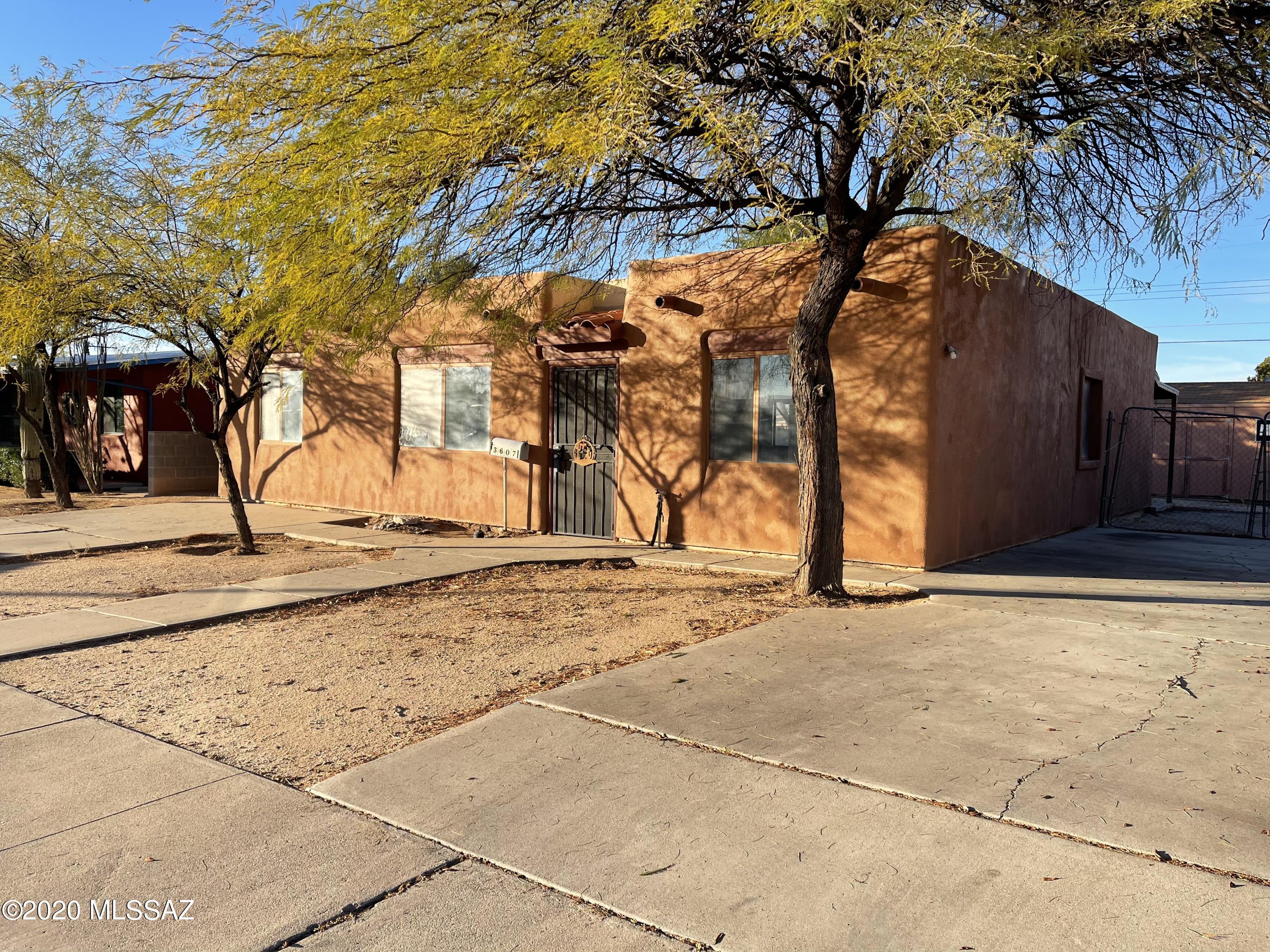 4 beds, 2 bath Santa Fe style house with Central AC, split floor plan with large backyard and interior
laundry room. Located near Reed Park, The University of Arizona, Davis-Monthan Airforce Base and several grocery stores. Property is
zoned R2 with lot size of 6534 sqft so it could be possible to build a second unit, buyer(s) should verify that before purchase.  This is a ''Fix-up'' Property