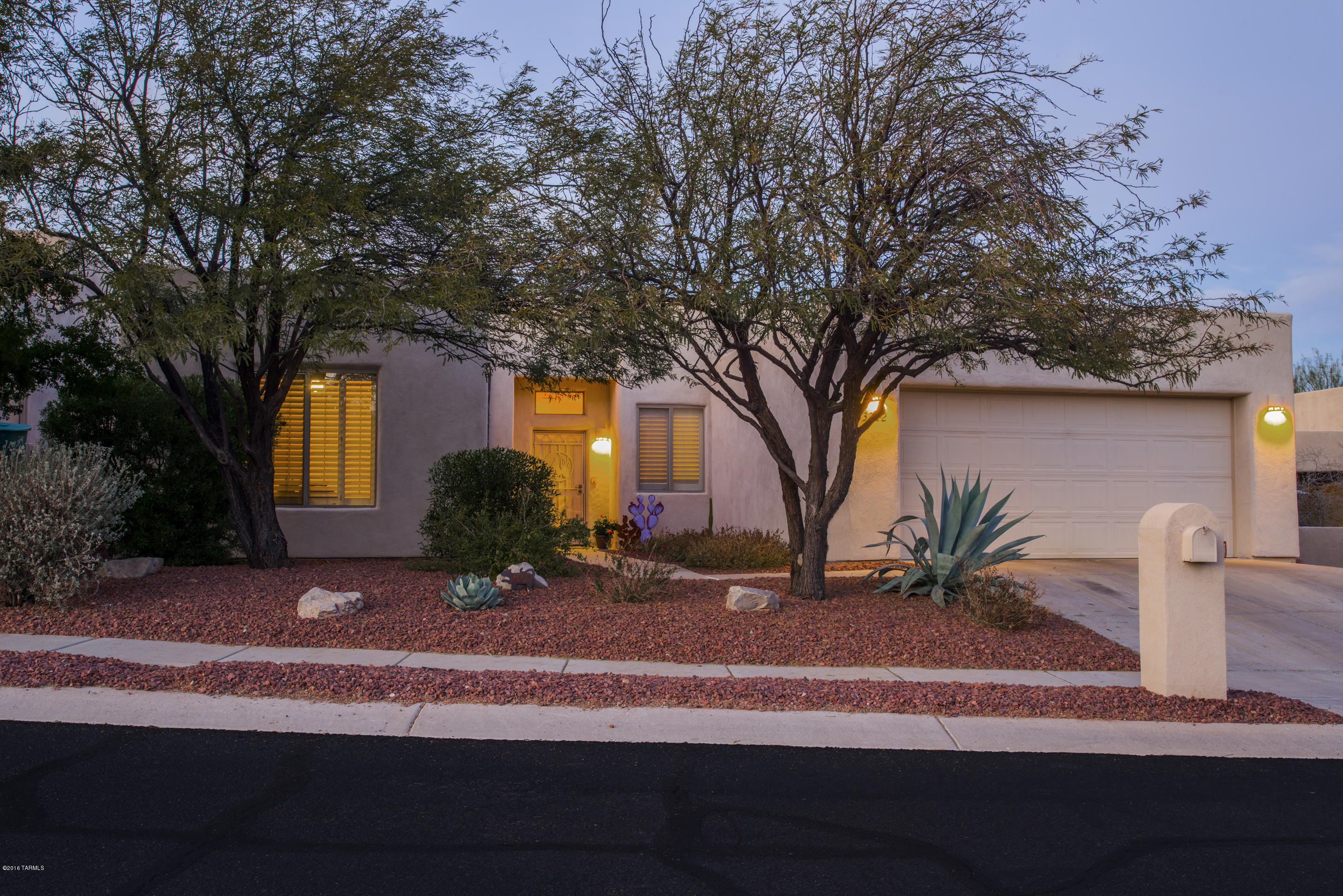 One owner impeccably maintained Southwestern style home in peaceful gated community surrounded by magnificent views. Indoor/outdoor living at its finest lush landscaping, rear yard fountain, kitchen natural gas BBQ, gas colored glass slate fire pit, misting system and yummy spa. Interior custom mural on kiva fireplace, tala vera accents throughout, plantation shutters, newer AC 17 seer, surround sound in great room, wet bar,  large breakfast bar perfect for all those who love to be in the kitchen with the cook.  Popular subdivision in Starr Pass home of the JW Marriott Resort and Spa, surround by nature yet minutes away from U of A, Pima College, Raytheon, Tucson's exciting downtown atmosphere, interstate and airport. Flooring allowance available with acceptable offer.