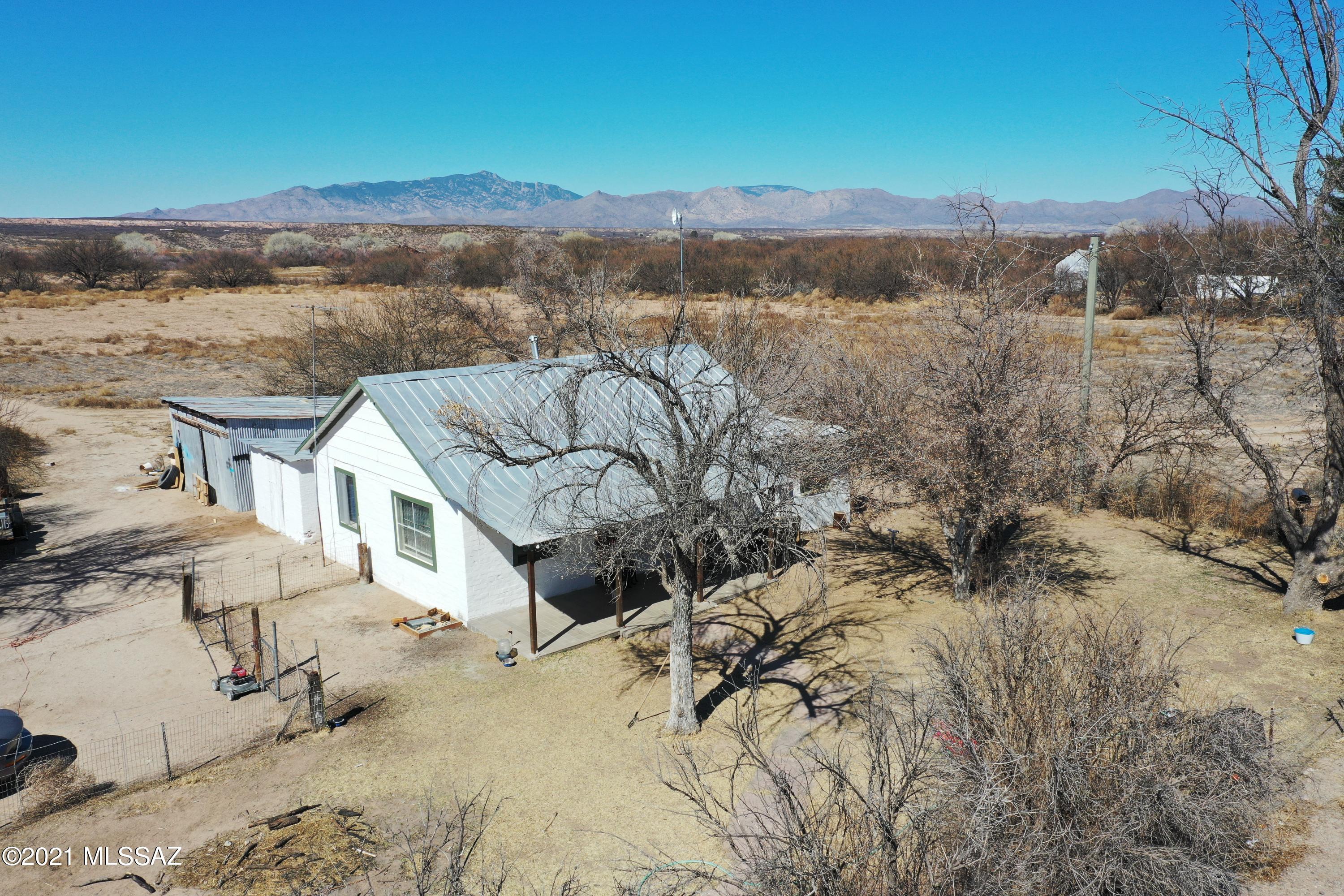 Cute 1947 farmhouse on 1.48 acres. 1 bedroom, 1 bath with office. Beautiful property with trees lots of room to grow. Space to build a new house and keep the old home as a guest house. Just off a paved road with city utilities. Come enjoy your quiet country retreat!