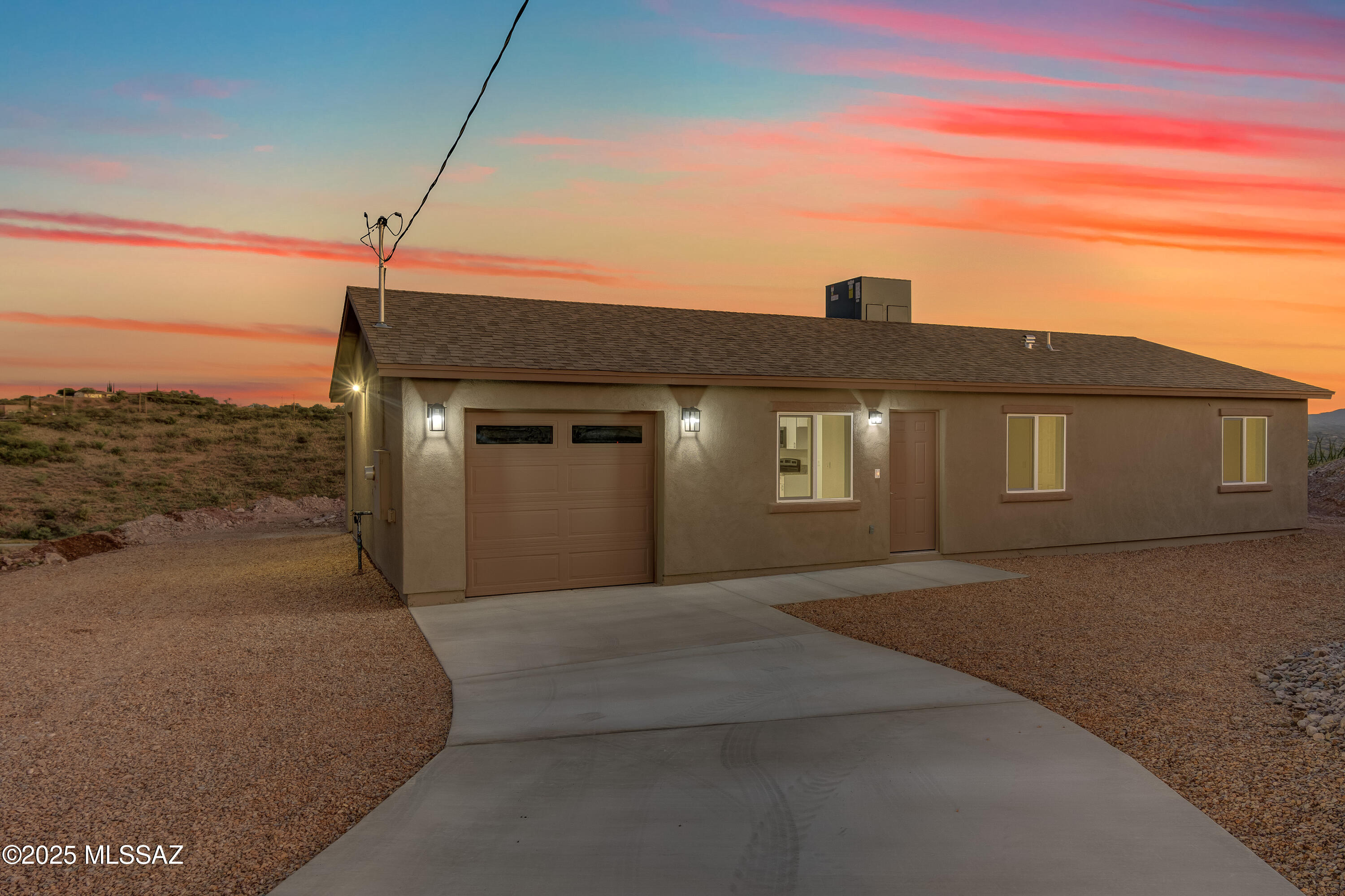 Home qualifies for 4.99% financing with preferred lender, ask me for details!! Home also qualifies for USDA 0% down! Beautiful new construction, turn-key ready home! Come tour this well laid out open floor plan including open kitchen concept featuring new stainless-steel appliances and a neutral color palette. This home features 3 bedrooms, 2 bathrooms AND 1 car garage. No HOA & located off a paved road. All bedrooms have a very spacious feel with tile throughout, and they also all have ceiling fans already installed. Sweeping mountain views from every direction. Home is located a few miles from I-19 making it a very easy commute to Tucson, Nogales and surrounding areas. Call me to schedule your showing today!