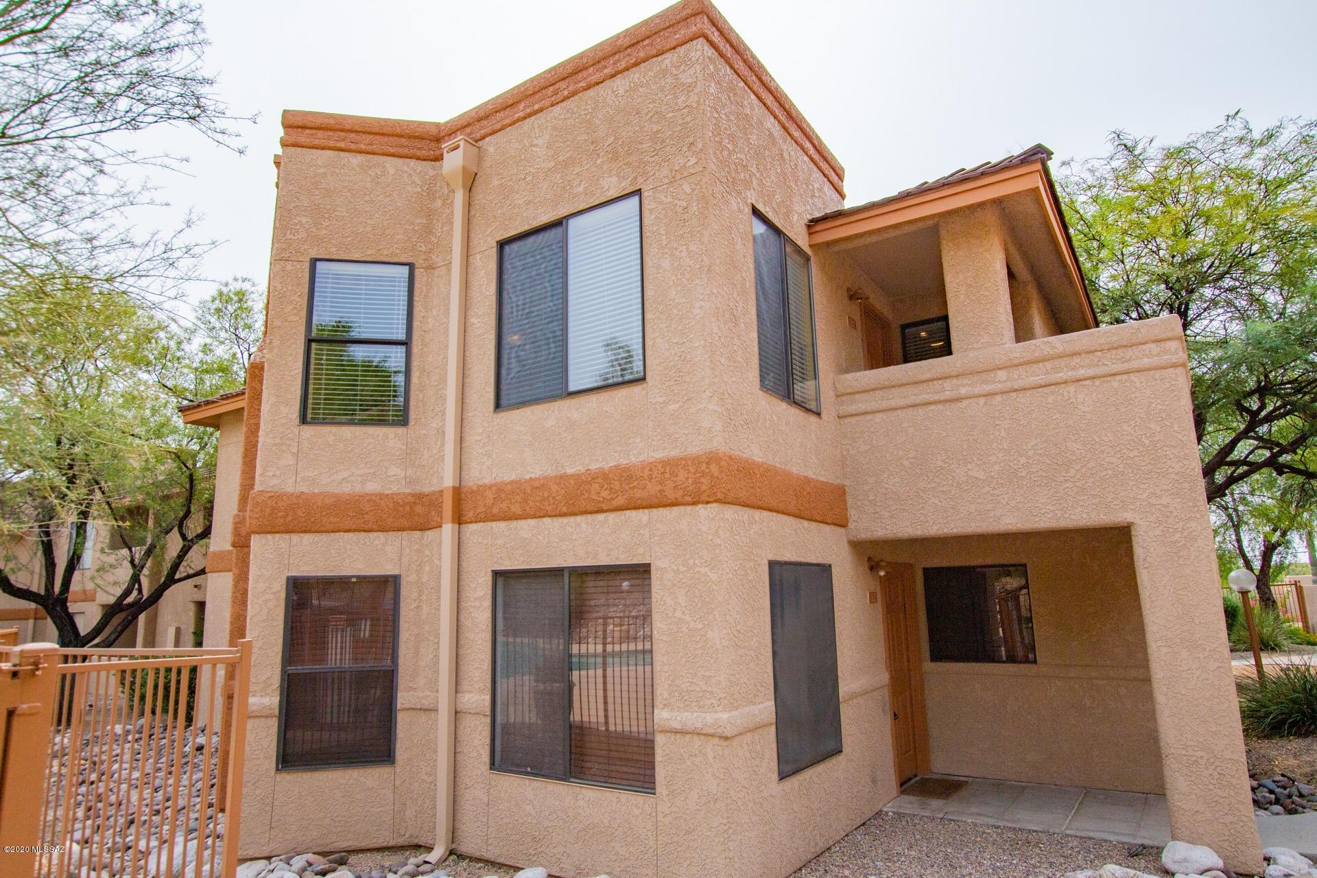 Welcome to the Gated Community of the Villas at Sabino Condominiums.  Open floor plan, welcoming palette, cozy fireplace, window blinds, ceiling fans, & plush carpet.  private balcony. Granite kitchen counters, SS appliances, pantry, open shelves, neutral tiled floor & handsome wood cabinets.  Dining area is bright & open. 
Master retreat boasts private balcony access. Interior laundry closet for your convenience. Fantastic Poolside & Mountain Views.  Best location in the complex!
