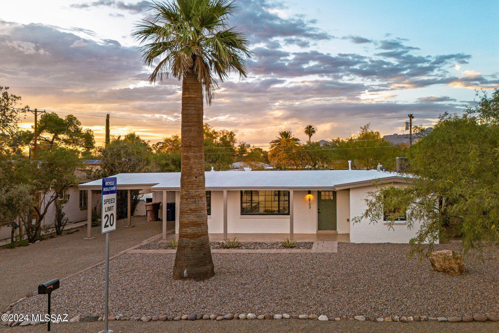 Located in the heart of Tucson's historic Broadmoor subdivision, this beautifully renovated 2-bedroom, 1-bath Ranch style home offers modern comfort on a spacious 9,000 sqft lot. Features include a chef's kitchen with sleek countertops and stainless steel appliances, concrete floors, new windows, updated electrical, and a brand new AC unit. The property also boasts covered front and rear patios, a covered carport, and an attached workshop, perfect for hobbies or storage. Perfectly situated just minutes from the University of Arizona, shopping, and restaurants, this home blends historic charm with contemporary living. 
*Property is classified as a contributing property with the Broadmoor Historic District and is eligible for an owner-occupied tax reduction of approximately 40%.*