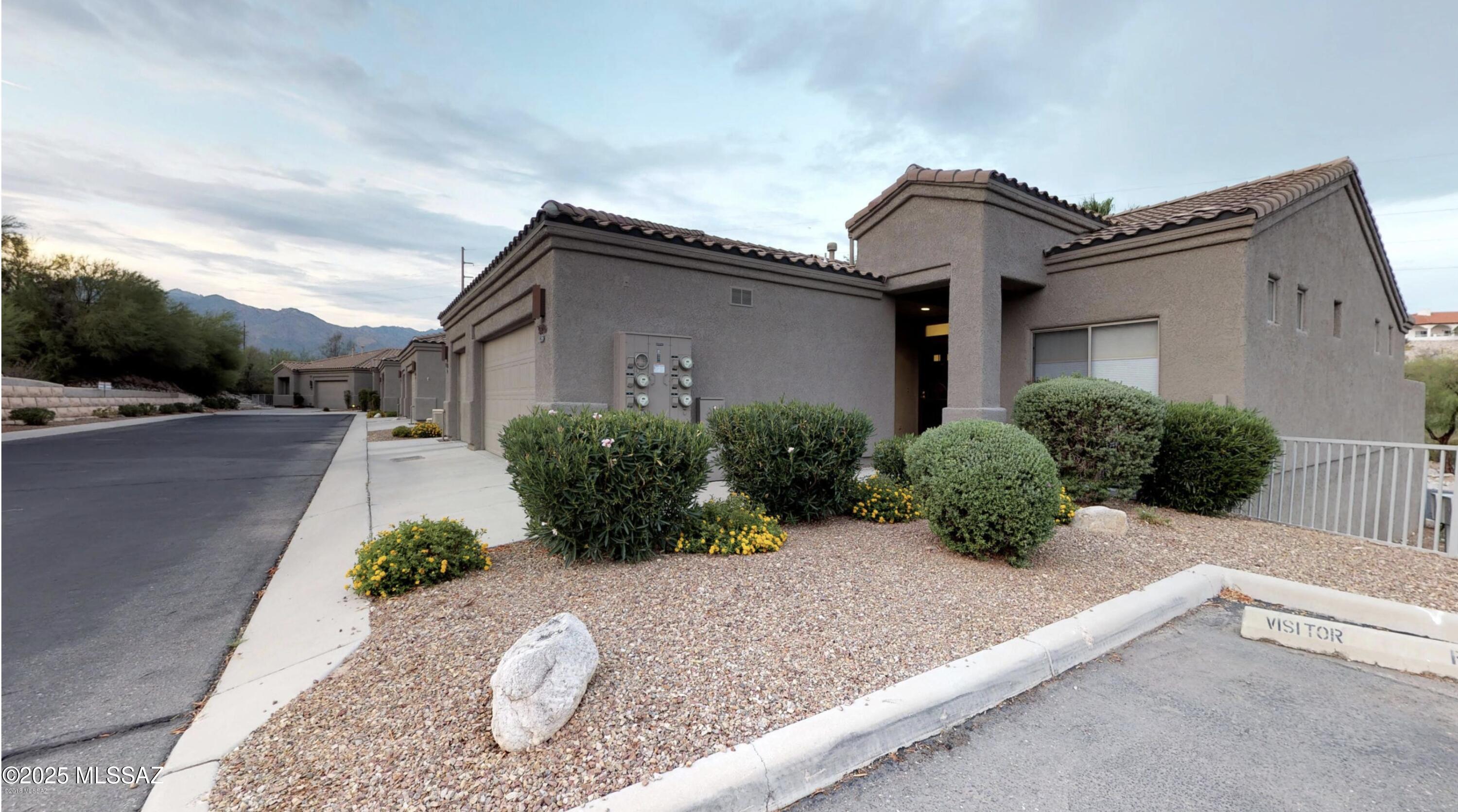 One Store. Ideal gated Catalina Foothills location with all the convenience of shopping & restaurants nearby, walking distance to Whole Foods, the Riverwalk Loop, Ft Lowell Park, Library, Fine Dining, BASIS, Gregory, & Castle Hill Schools, close to Tucson Medical Center & just minutes to golf & Sabino Canyon. Kitchen has gas range & opens to great room w/fireplace & soaring ceilings. Split bedrooms - both BR have walk-in closets and wood laminate floors. Master Bath has walk-in shower. Spacious covered patio has small, ow care walled in yard has southeastern exposure & overlooks common area & community pool. Listing agent is related to the Seller.