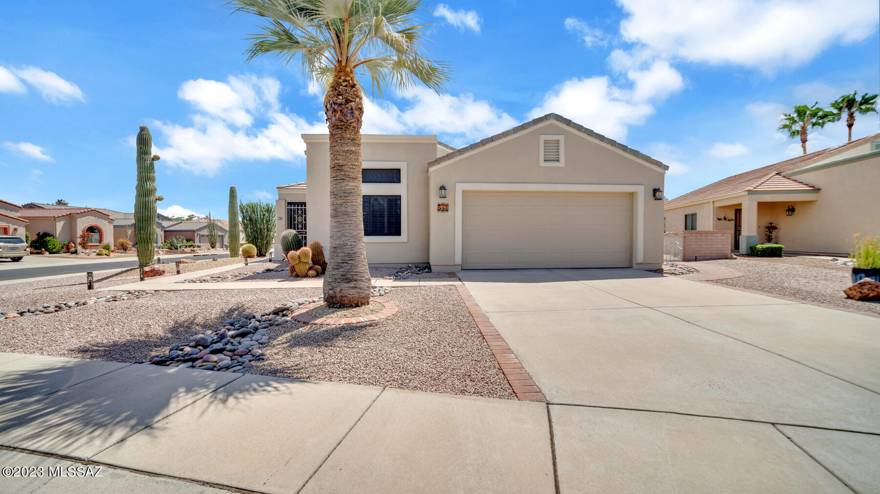 Situated on a corner lot within a prestigious gated community, every aspect of this home has been carefully considered to provide a comfortable & upscale living experience.As you approach the front entrance, you'll immediately notice the elegant exterior and well-maintained landscaping that sets the tone for what's inside. Modern interior featuring sleek black stainless steel appliances that adorn the kitchen. The kitchen also boasts a state-of-the-art filtered drinking water system, ensuring that you have access to pure and refreshing water at all times. The oversized stainless steel sink, complete with a new faucet and integrated cutting board, provides both functionality & style for your culinary endeavors. The thoughtful design includes 3 screened-in patios. Click more for description Plantation shutters grace every window throughout the home, allowing you to control the natural light and maintain your privacy effortlessly. The tile flooring throughout the home not only adds a touch of sophistication but also ensures easy maintenance and durability.The split bedroom floor plan offers maximum privacy, with the master suite on one side and the guest bedroom on the other. The master bathroom has been elegantly remodeled, featuring sleek rectangle sinks, custom lighting that highlights the space beautifully, and a shower tower that provides a spa-like experience. The framed mirrors and tiled backsplash add a touch of luxury to this private oasis. Practicality meets functionality with a desk in the laundry room, providing a convenient space for managing household tasks. The garage has been optimized with extra cabinets, a workbench, & a utility sink, making it a perfect space for DIY projects and extra storage. The astro turf putting green offers a fun and low-maintenance space for golf enthusiasts and those looking to unwind in the outdoors. Make it yours today!