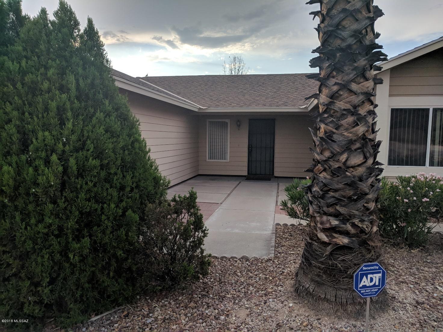 Look no further!  Awesome family home with 4 bedrooms, 2 baths, bonus room, could be a 5th bedroom, office, etc.  In the picturesque backyard, there's a separate storage/guest quarter/hobby area/you name it, complete with window AC, and electric! Big LR, & kitchen, separate dining room, off kitchen is a family room with FP, and french doors to the yard, and covered patio.  
Master bedroom has separate dressing area, and big closet, with door to yard, with it's own covered patio area.  Guest bedrooms are good-sized, with plush carpet, and ceiling fans in 2. 
Garage enters the large laundry room, with cabinets.  Garage also has cabinets for keeping all your stuff in it's place.  Community pool is visible from your front yard, walk to the pool or playground area!
Come see your new home!