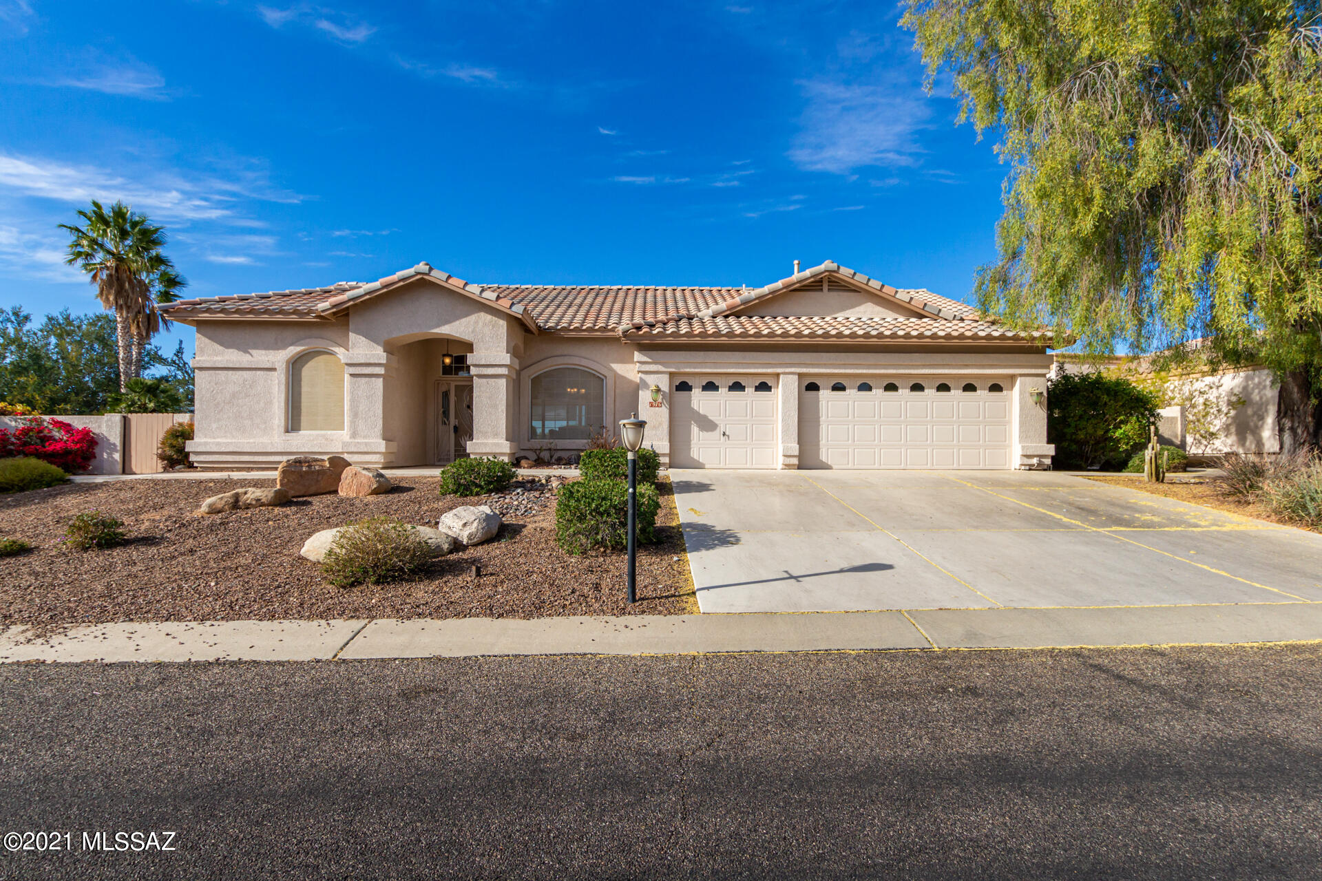 A relaxing lifestyle in the heart of Oro Valley with a golf course and Catalina Mountain Views! Beautifully remodeled 4 bedrooms and 3 baths with new interior paint, light fixtures, carpet, and more.The very light and open floor plan is welcoming. The kitchen is equipped with SS appliances, an abundance of modern cabinets, and a breakfast bar. Step outside to the backyard paradise. The covered patio has ceiling fan and paver flooring. Amazing masonry fire pit and sitting bench is  perfect for roasting s'mores. Built in outdoor BBQ is great for evening cookouts. After a long day, take a splash in the sparkling pool or spa. Make this your dream home today! Owner is a licensed agent.
