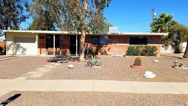 Do not miss the opportunity to see this adorable red brick home with endless charm and character. Great floorplan with 3 bedrooms, 2 bathrooms AND a bonus room! Beautiful kitchen with granite countertops and newer appliances.
Huge walk-in pantry, tons of storage space, tile and laminate throughout (no carpet!). Updated windows, bathrooms and freshly painted interior. Large backyard with a fenced 10' diving pool, covered patio, built in BBQ and block wall that backs to a drive thru alleyway. Mature vegetation and low maintenance landscaping around the property.  1 car garage, space to park an RV and no HOA! Close to parks, schools, shopping, dining and DMAFB.