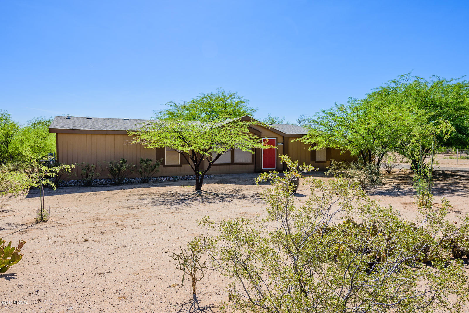 This immaculately maintained property is located on over an acre with mature mesquite trees and custom wall for privacy! Also includes huge shed for workshop and garage to park cars and toys in! Don't miss this excellent opportunity!
