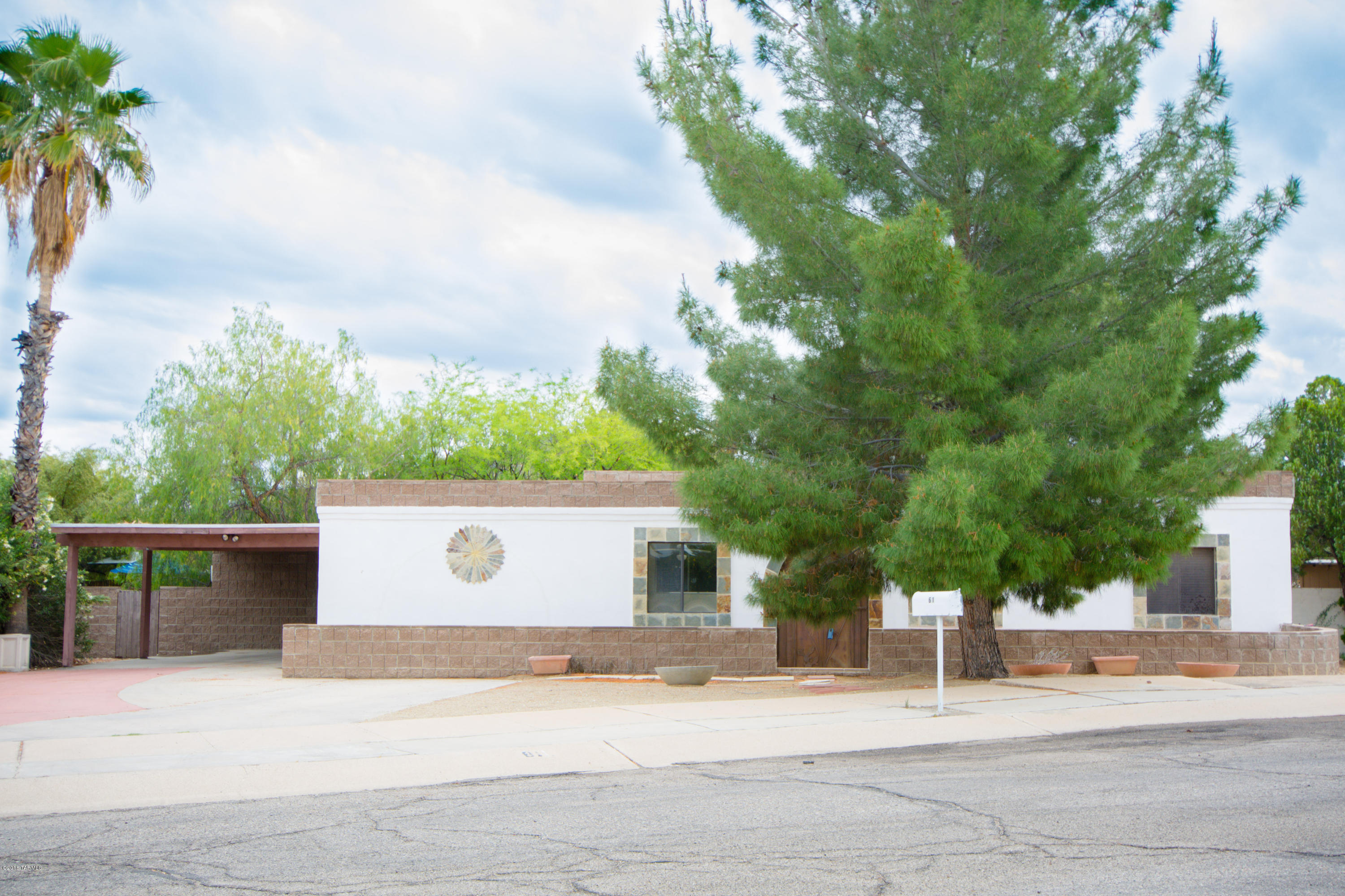 Lovely 4 bedroom home on quiet cul de sac in Tucson Park West! MOVE IN READY, this is a wonderful family home w/ a flexible floor plan & includes 1837 SF, tile in most rooms, new carpet & fresh paint. The updated kitchen w/ stainless appliances open to the great room w/ bee-hive fireplace. The large laundry room has plenty of space for additional pantry items.  The den could be a large office or 5th bedroom. The airy artist studio or workshop complete this beautiful home. You will love the spacious private backyard with a beautiful covered brick patio. Ideally situated, this terrific neighborhood is close to Hiking, Pima College West, St Mary’s Hospital, Star Pass and Downtown.
