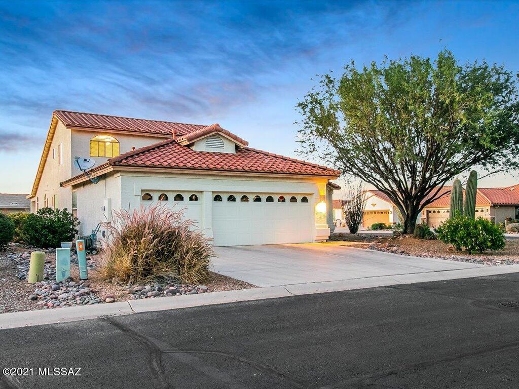 This expansive floorplan offers a formal living room, dining room, private den, and a great room. The gourmet kitchen features maple cabinets, huge island, dining nook, dry bar and a walk in pantry. Plenty of room to relax with the spacious Owners Suite on the first floor that includes a soaking tub, double vanities, and a huge walk-in closet. Welcome guests with the ''upstairs casita'' that includes 2 additional bedrooms and a full bath. Your guests will love the views from upstairs! Home also includes zoned A/C,  
new flooring in hall ways, master bath & guest bathroom, corner lot, new roof in 2019, expansive laundry room, and a 3 car garage.