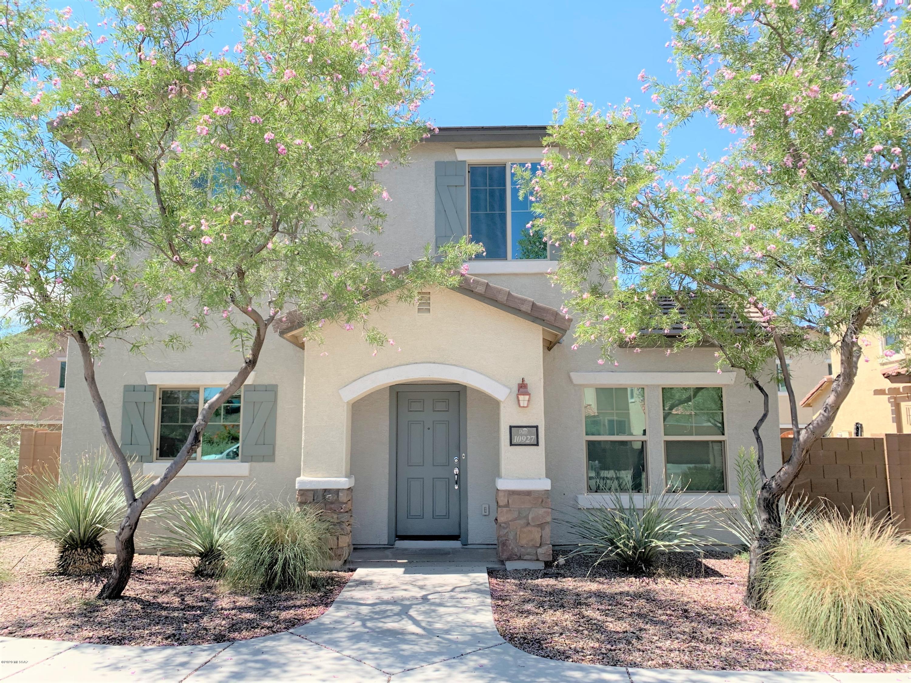No Application Fees!  Very Nice 3 bedroom, 2.5 Bathroom home in Sierra Morado.  This home is close to Saguaro National Park.  Several upgrades including tile flooring downstairs, ceilings fans in each room, upgraded window blinds.  Open kitchen features granite counter tops, large island, separate dining area, upgraded cabinets, ceramic top electric range, stove top microwave, refrigerator and dishwasher.  Large master bedroom with walk in closet and double sinks.  Two car garage and convenient upstairs laundry.  Large backyard covered patio great for entertaining.    Community pool offers all of the fun with none of the work.