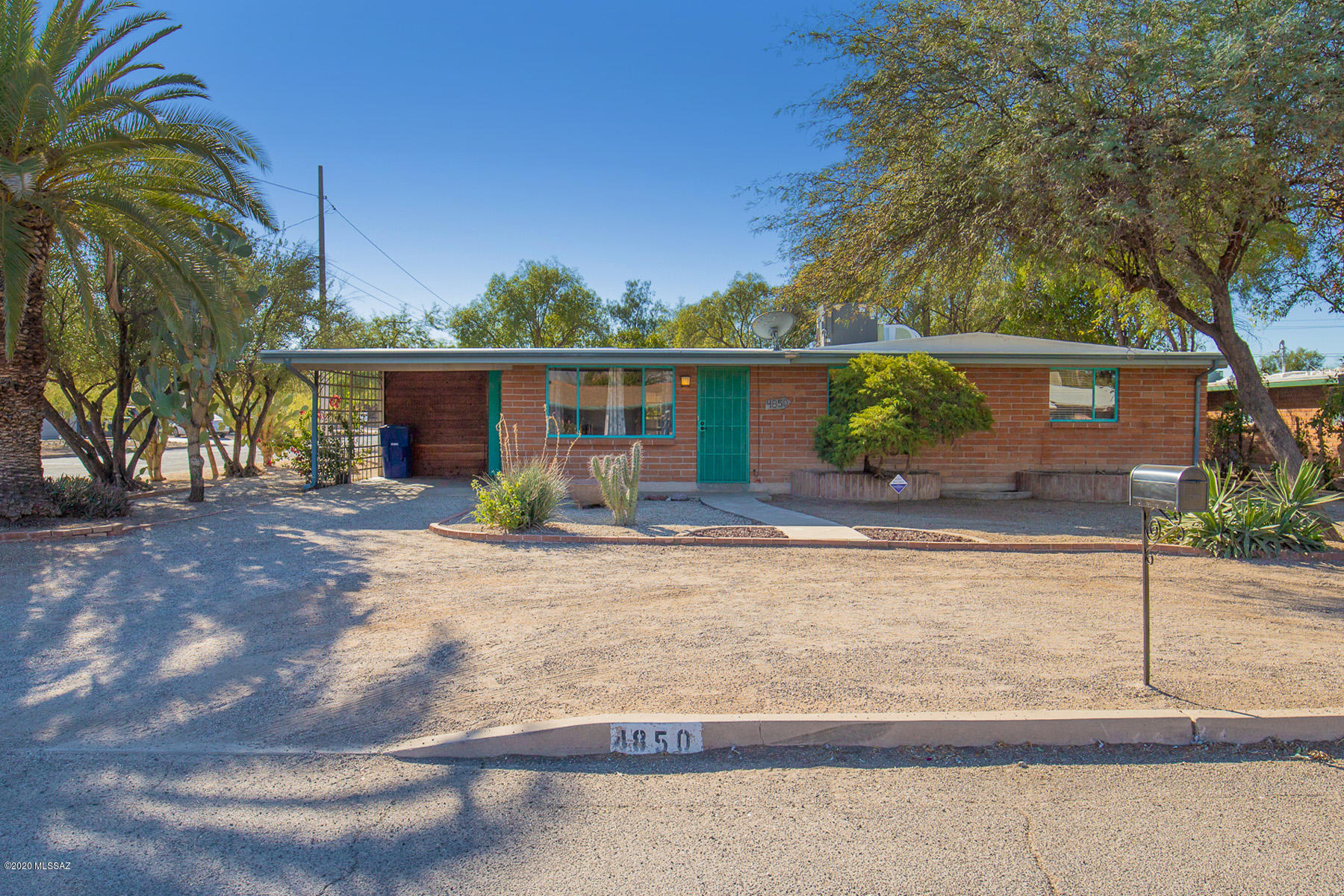 Don't miss this lovely midtown 3 bedroom Adobe Brick home on a corner lot. Lovely neighborhood. Ideal location-close to shopping, restaurants and downtown. The entire inside is newly painted. Traditional Mexican/Saltillo/Ceramic tile throughout. Two skylights enhance the eating/kitchen area. Roof maintenance and recoated with 3 year warranty. Sewer line hydro jetted and replaced one split pipe with 10year warranty from fitting to fitting. New Gas Pack was installed in 2012. Large shaded backyard with screened in porch. Back portion has room for an RV.