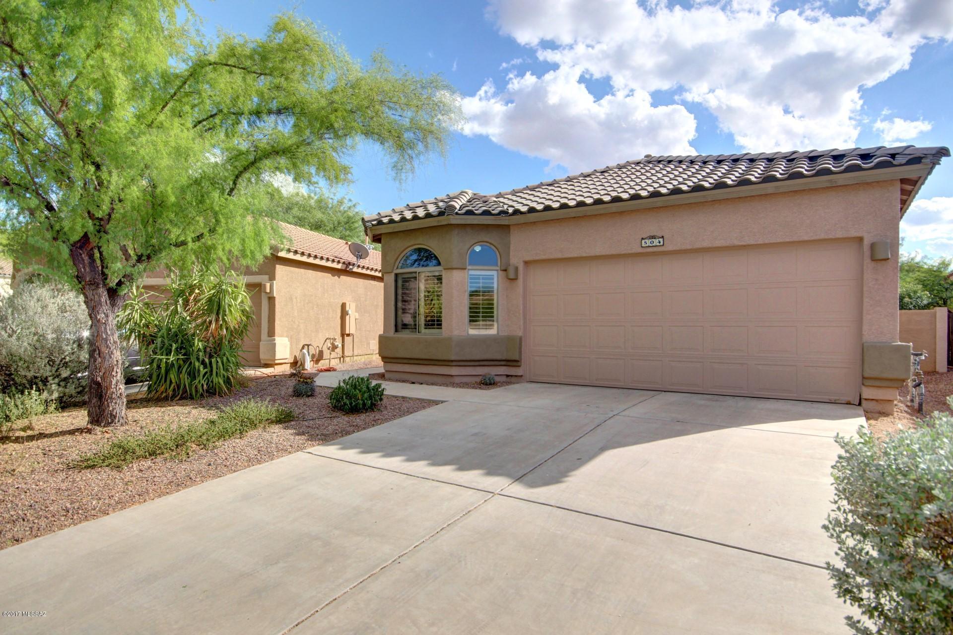 Amazing single level Home with soaring ceilings custom palette, plantation shutters, ceiling fans, plush carpet, plant shelves, and spacious open floor plan. Fantastic eat-in kitchen features center island, breakfast bar, stylish counters, white appliances, tile floor, and oak cabinets. Grand master retreat boasts vaulted ceiling, walk-in closet, and private en suite. This meticulous Home is move-in ready! Peaceful & serene backyard offers covered patio, flagstone pavers, shade trees, dining patio, and endless blue skies. Will NOT last! Fire Protection subscription through Rural Metro. Plantation Shutters Stay. Water: Sahuarita Water Co. Please Note: The furnishings in the home DO NOT covey.