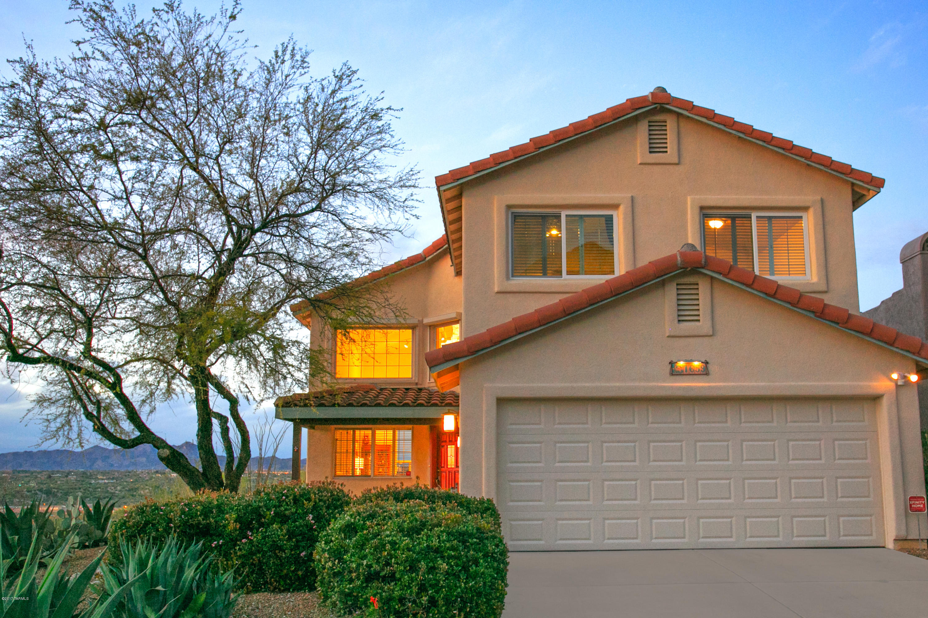 Million dollar views from this one of a kind lot in gated La Reserve. Enjoy the city lights from the newer Thomasville kitchen with granite counters,designer back splash & pull outs. Perfect outdoor patio with beehive fireplace for watching the sunset & twinkling lights. Over sized master bedroom with dual sinks, large tile shower and your own private balcony. Bedrooms 2 and 3  look  right at Pusch Ridge!  Spacious  Living room and dining area plus great room with fireplace add to the charm. Community pool and spa a short walk up the street. Enjoy the privacy and views from this fabulous lot.