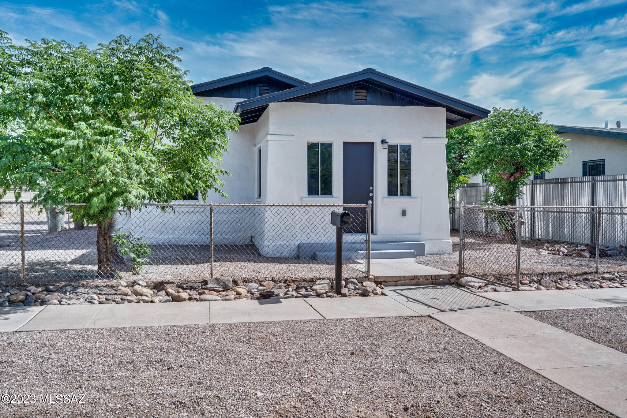 Darling Historic home in highly desired Armory Park. Beautifully updated home features fully upgraded electrical and new water heater. Just minutes from Downtown Tucson & University of Arizona. This neighborhood has a high bike score (94) and is very walkable with amenities for all.  Amenities include dining, shopping, breweries, indoor sports, biking, hiking and more. Unique zoning HO3 allows for home business, short term rentals and long term rentals. This property also has plenty of room for an additional dwelling.