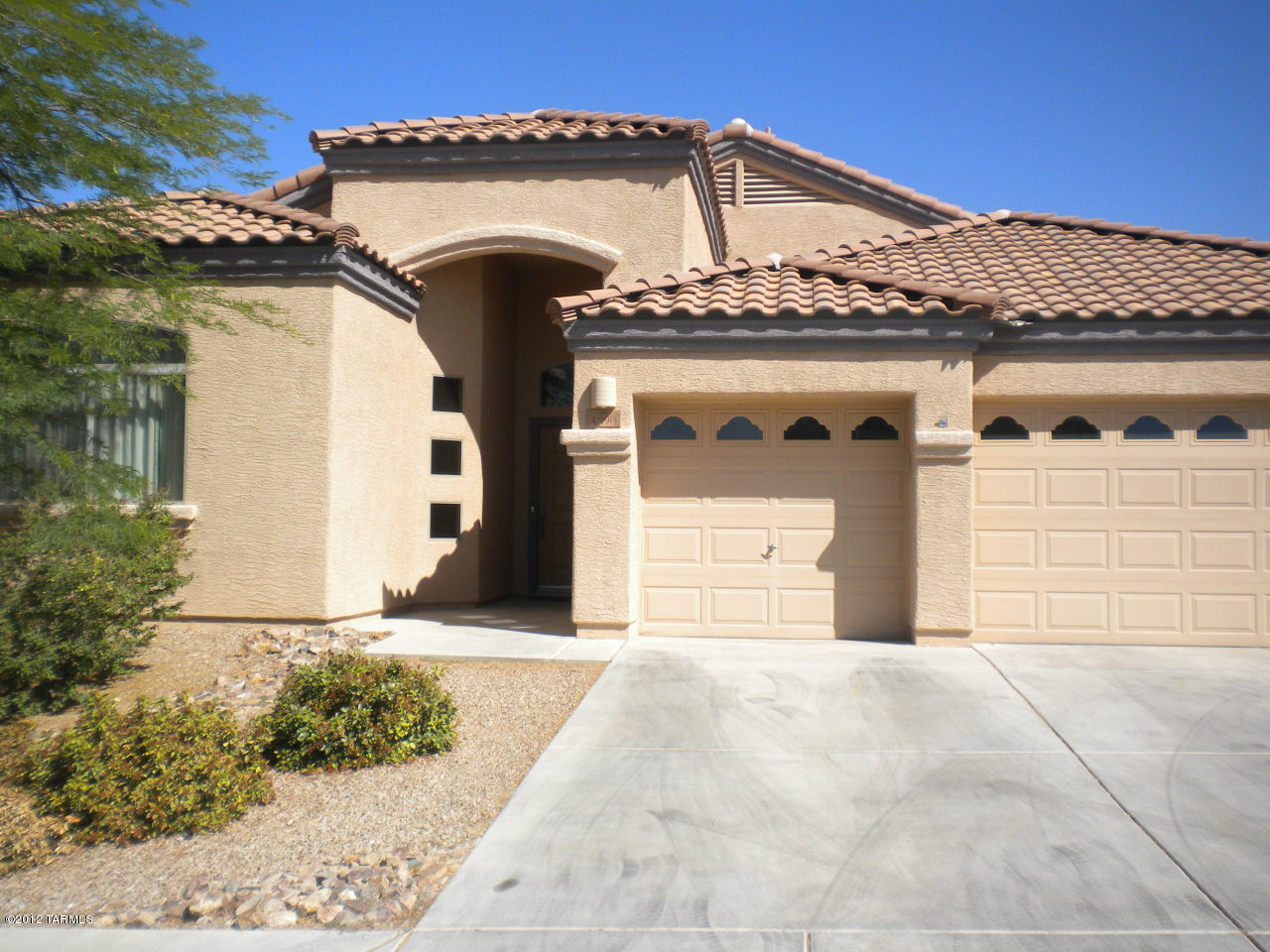 This is a beautiful 4 bedroom 2 bath home with many upgrades. Gated Community. Backyard has built in BBQ and firepit.  GE Profile appliances.  A Den off the kitchen.  No carpet - all woodgrain ceramic - beautiful and newly installed. Views are unobstructed from the back with wrought iron fencing and separate pet run with a dog house built in.  Small dog door in the master.  Pets upon approval.