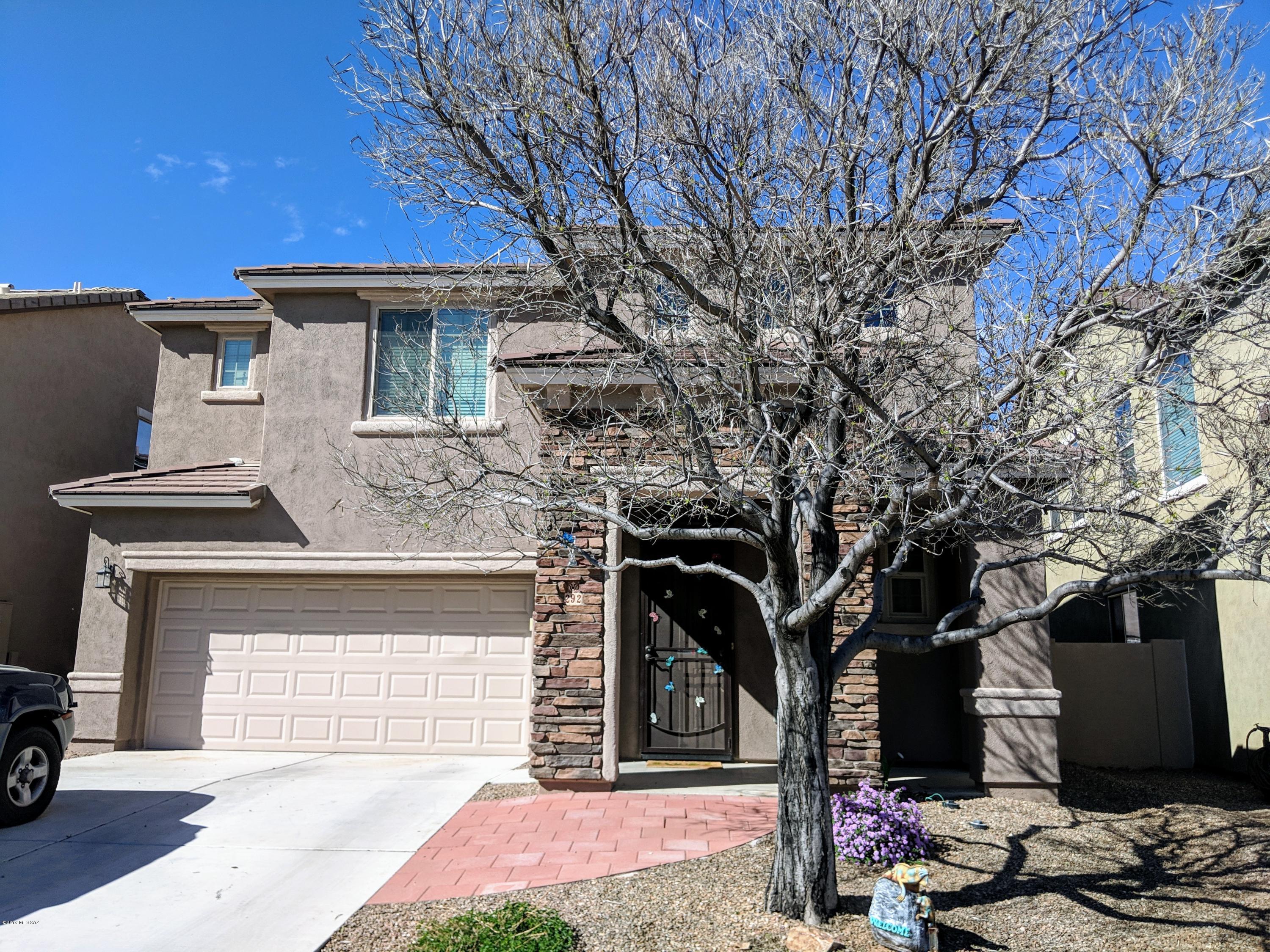 Beautiful 5 bedroom, 3.5 bath home with a bedroom and full bath downstairs, that's perfect guest quarters, or great for that intergenerational living. Granite counters, tile backsplash, custom paint, & upgraded cabinets in your chef's kitchen! There's a gorgeous double sided gas fireplace, separating the dining and family room. HUGE, tiled walk-in shower in master bath! Close to all the amenities Rancho Sahuarita offers, and walking distance to the north satellite park and pool. Priced below comps for a quick sale. Seller is offering $3000 towards a carpet allowance, of buyers choice, at closing. This home will sell fast, so see it today!
