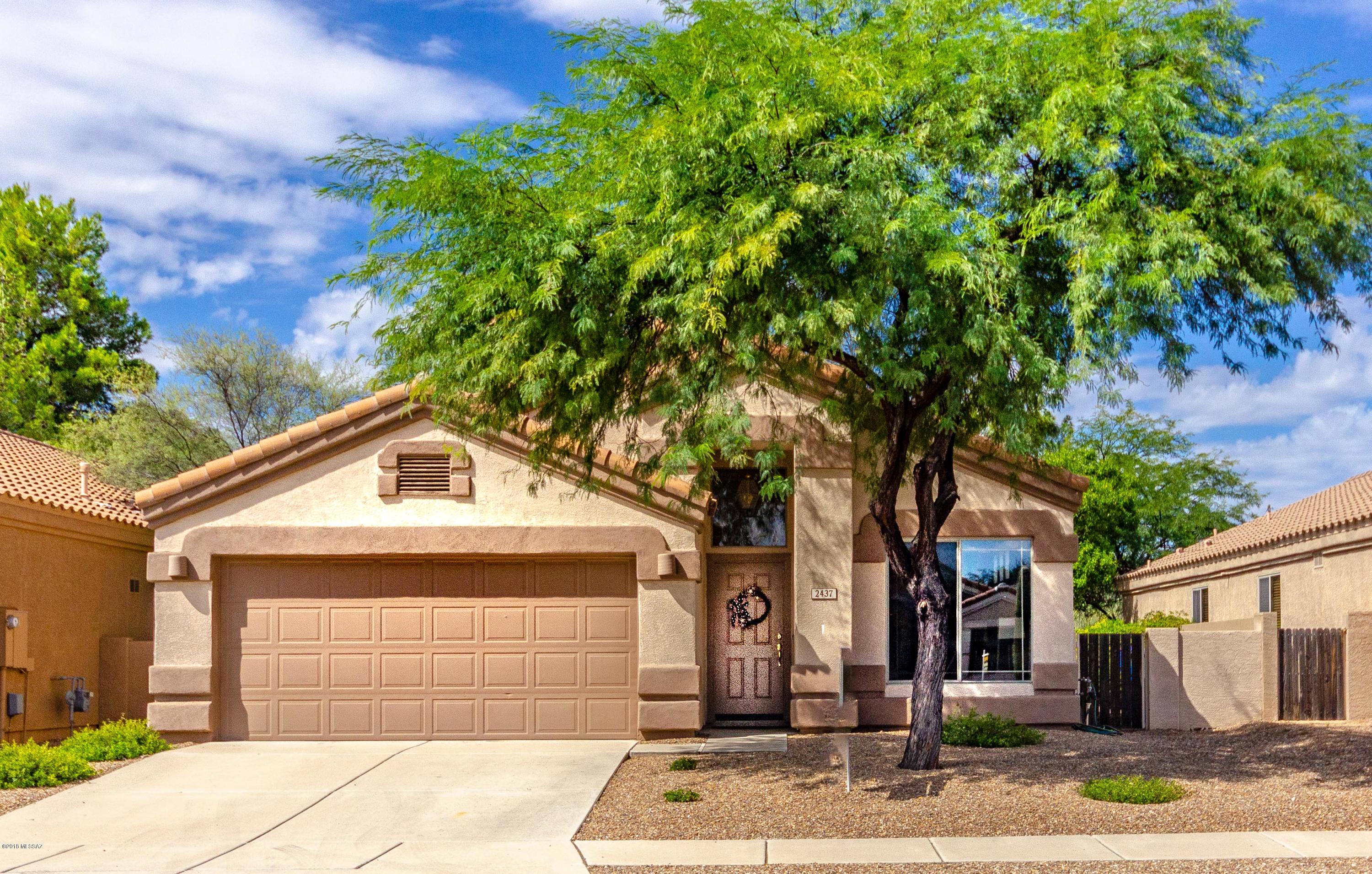 BEAUTIFUL LAKESIDE GATED COMMUNITY, ALL SINGLE LEVEL. Stunning 4 bedroom, 2 bath home set against a private desert setting with shade trees. Upon entering the home, you'll love the high-vaulted ceilings and open floor plan with lots of natural light.  New granite countertops and stainless steel appliances.  Separate formal living and dining room. Master bedroom has 2 large separate walk-in closets. Dual vanity sinks in both master and spare bathrooms.  Enjoy the many community amenities: fitness center and recreation center, 2-heated community pools and spas, tennis and basketball courts, playground, walking/jogging paths, and many lakes for catch and release fishing. COME FALL IN LOVE WITH THIS HOME!