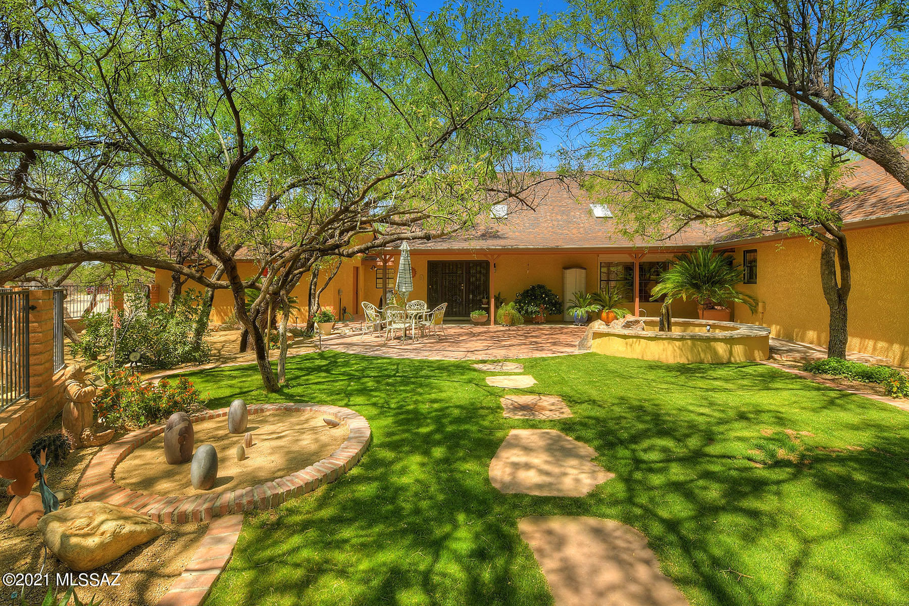 Rare opportunity to own nearly 6 acres of equestrian paradise!! Privacy and nature surround you at this 3 bedroom/3 bath custom home w/split floor plan design featuring loft office w/custom built-ins, AZ room, soaring ceilings, & spacious open-concept great room. Custom designed kitchen w/granite & butcher block counters, two ovens, breakfast bar, and wine fridge. Remodeled master suite with enormous walk-in closets, wood burning fireplace, spa-like bath, and private access to back patio. Two-story guest house w/loft bedroom, full bathroom, kitchenette, & full RV hook-up. Horse facilities are top-notch w/breezeway barn, 5 indoor/outdoor stalls, 3 fenced pastures, wash rack, multiple tack & storage rooms, & direct trail and wash access. Call today for a private showing-this one won't last!!