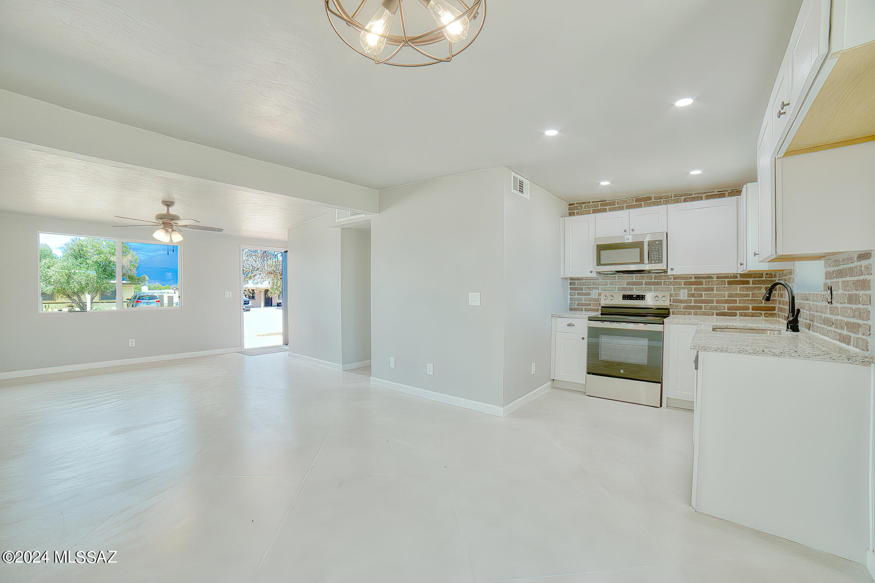Nicely remodeled mid-century home updated to fit todays lifestyle. Fresh, clean, and move in ready. All you need to do here is back up the moving truck and unload. Concrete floors, all new kitchen, windows, and bathrooms. you will love the open floor plan. Large .16 acre lot with fresh landscaping. Light, bright and cheerful you will notice the nice, comfortable homey vibe the minute you walk in to this wonderful home. Seller is licensed real estate agent in Arizona.