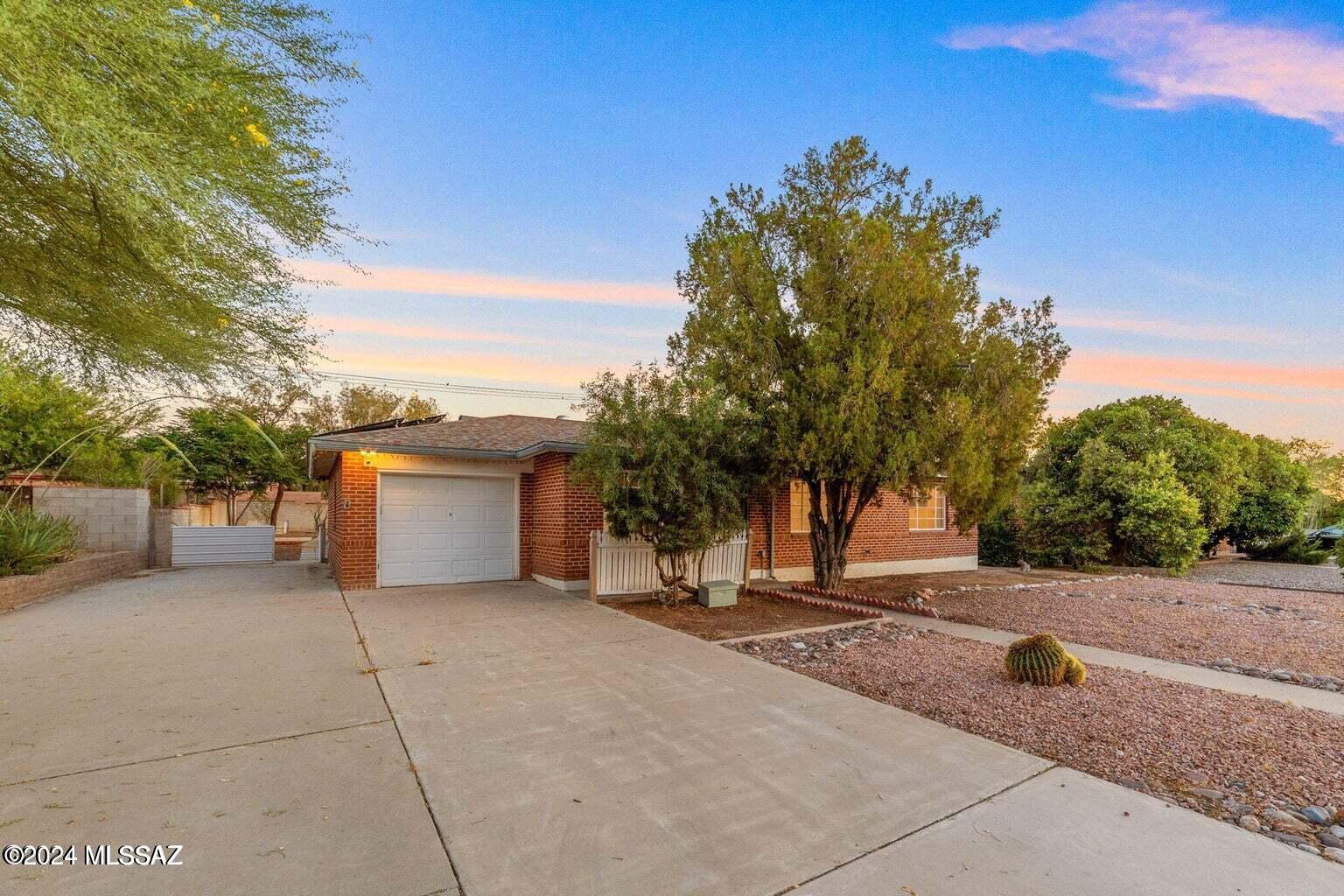 Beautiful 3-bedroom, 2-bathroom in a well-kept neighborhood. Located in a popular central neighborhood near shopping, restaurants, and entertainment.  Only 15 minutes to the University of Arizona, Downtown, and more! Ceramic tile flooring, upgraded bathrooms, and kitchen. Low monthly electric bills with SOLAR. Large backyard. 1-car carport for storage or a vehicle. Large covered patio in the back. The laundry room is off the patio. The lease term is negotiable.