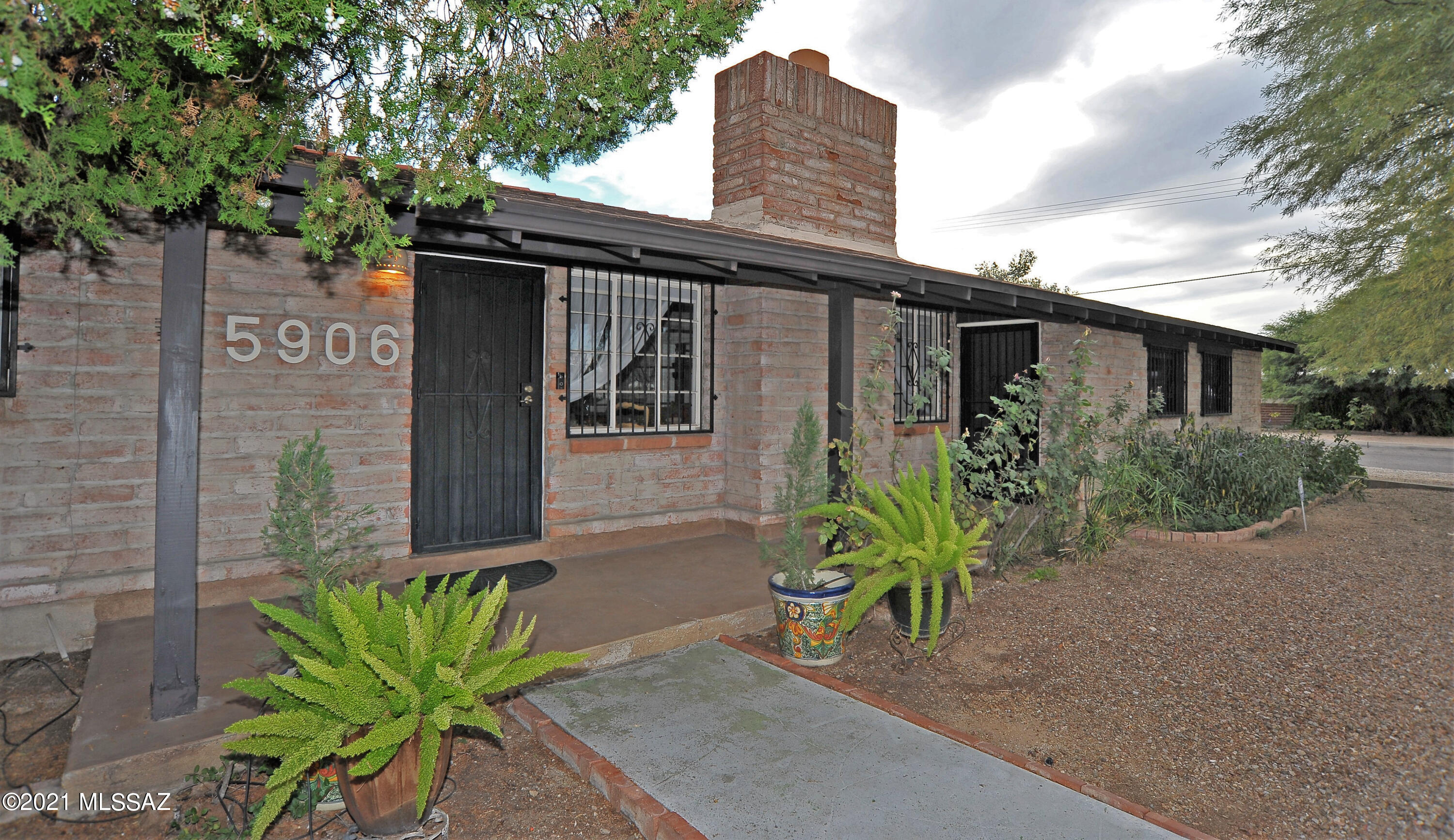 Quaint, classic mid-century home in convenient central location!  Gorgeous tongue and groove beamed ceiling, with upgraded wood laminate flooring and fireplace.  Three bedroom, 2.5 bath, 2200+ square foot corner lot backing against a private alleyway with a large office/den area.  No HOA!  Freshly painted interior.  Spacious and open backyard with multiple outdoor living spaces to entertain, and a large pool!  The property also features a detached, roughly 600 square foot air conditioned living space, with a full bathroom.  The opportunities are endless.  Come see for yourself!