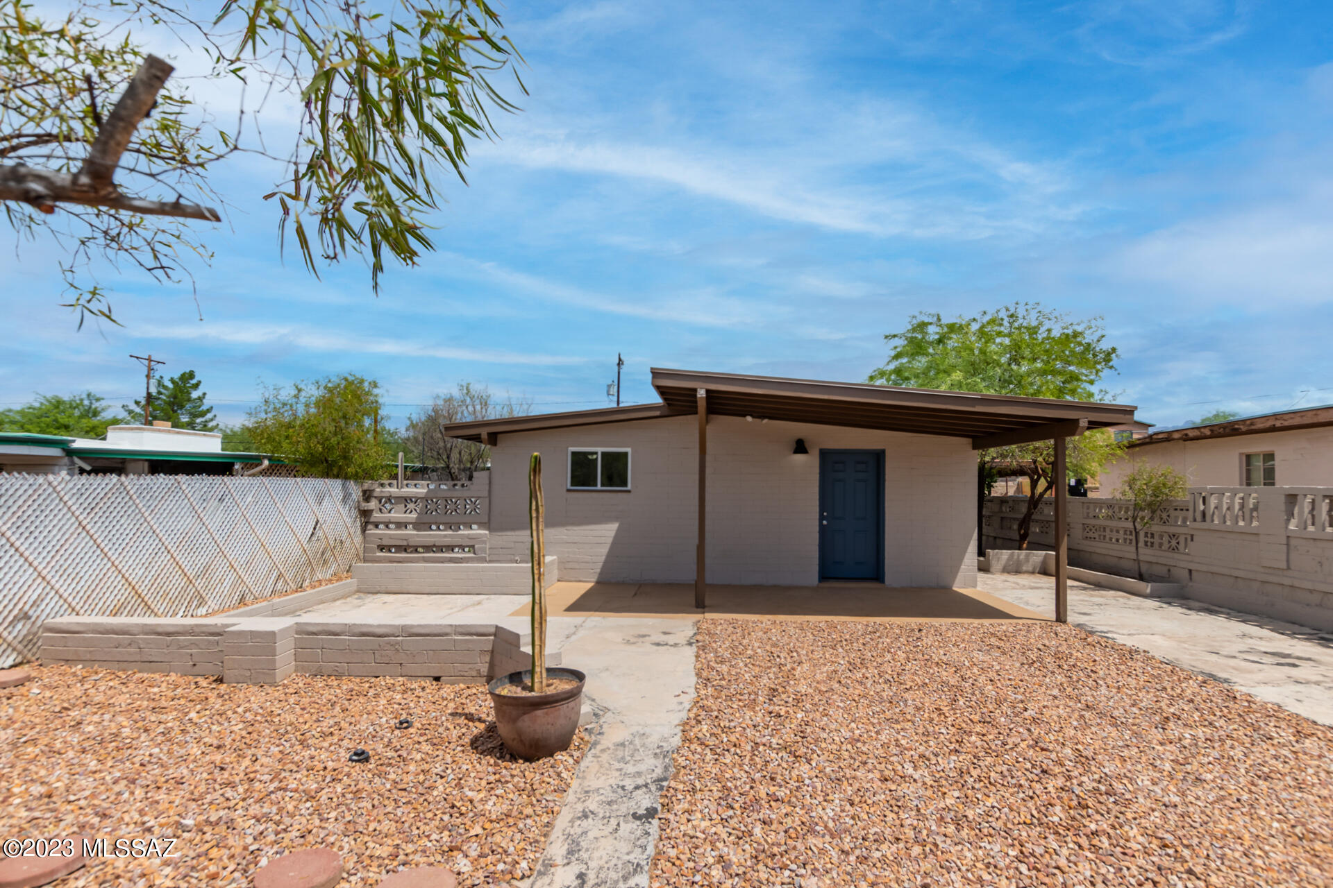 Be excited to live in this turnkey 3-bedroom property with an excellent location/close to U of A! Lovely interior features vaulted ceilings, tile flooring, and a welcoming living/dining room with recessed lighting. Enjoy casual dining in the sizable breakfast room with sliding glass doors leading to the side yard. The spotless kitchen includes SS appliances, white shaker cabinetry, and ample counter space for all your cooking needs. Carpeted main bedroom has a private bathroom for added comfort. Host gatherings in the large backyard with pavers, a storage shed, and a workshop area. This adorable abode is conveniently located near shopping spots, restaurants, and more. List range pricing, seller will except or counter offers between $298,700 - $309,000
