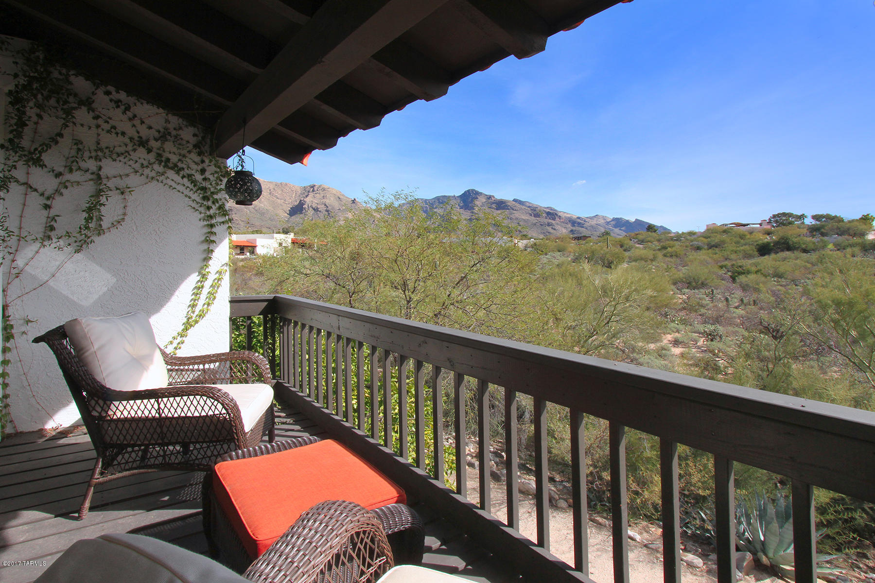 Located in the intimate community of Westward Look Guest Ranch,this home features a courtyard entry with a large area for outdoor dining & a balcony with Mountain Views.Dine and relax on the balcony with only views in site! This home feels very private.The ground level features a 2-car garage,large updated kitchen,new wood-grain tile throughout, fireplace with gorgeous new veneer, 2 dual pane sliders leading to  balcony & a spacious master bedroom with an updated bathroom & also dual pane sliders leading to the balcony,a laundry room off the master & a 1/2 bath off the living area. All you need for comfort is on the ground level.All sliders have remote shades. The stair case is wide with one landing making it easy to navigate. Please click on more to read more about the lower level. The Lower level offers the perfect retreat for guests, kids, playroom, workout area, art studio, caretaker or home office. This living area features tile floors, & a fireplace. Two sliders on either side of the fireplace provide access to a lovely covered patio with views. A second master suite with full bath & glass sliders to the covered patio complete this private second-levl space. A separate large walk-in storage room is ideal for travel favorites/gear, holiday, and seasonal items.   There is an easement road leading to this area. Community pool and spa are heated year round for family fun, & an active homeowners association adds a friendly feel. HOA covers basic cable, private roads, landscape maintenance of common area, trash pick up, community pool, spa, sauna, club room with kitchen, insurance and taxes for common area.