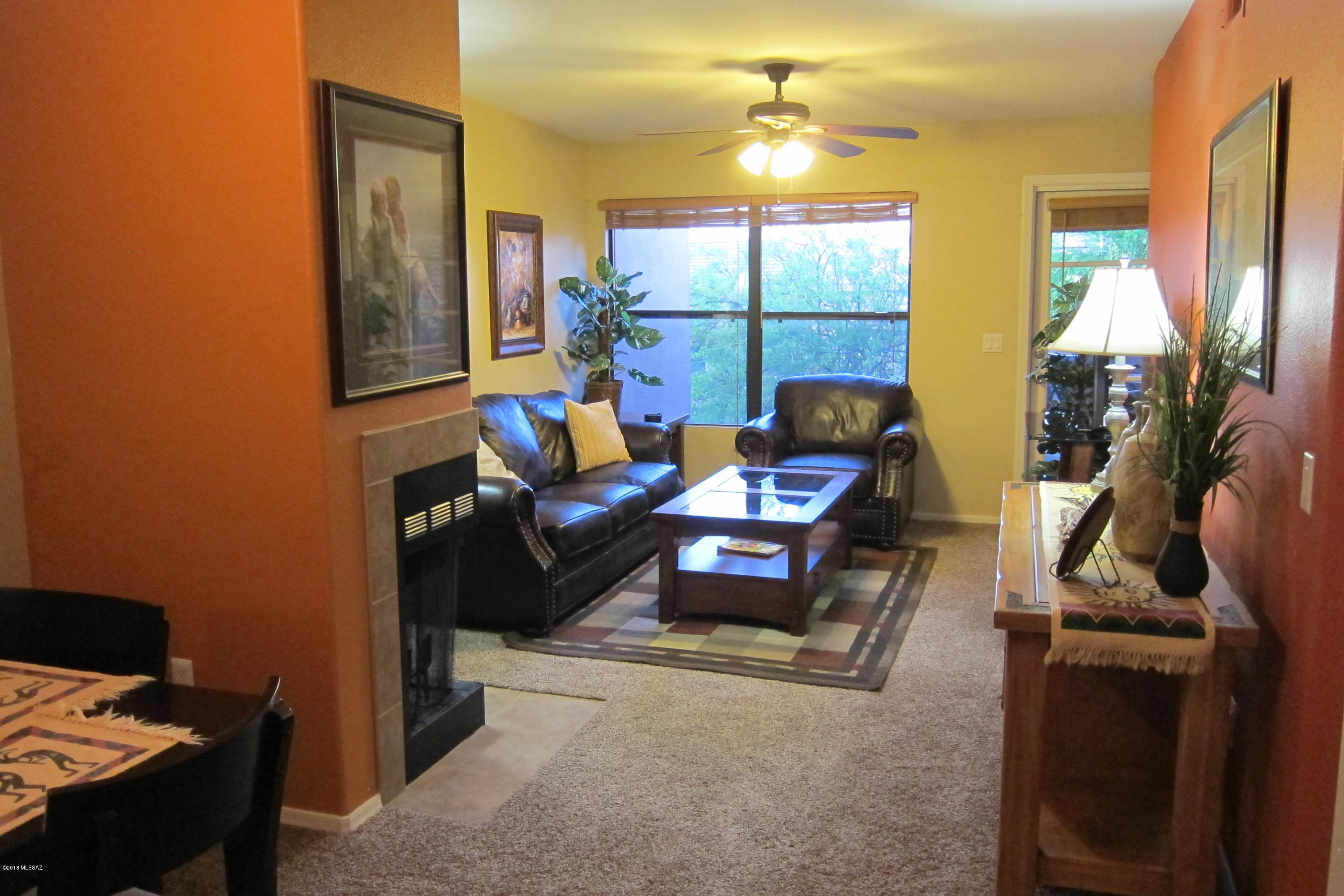 SECOND FLOOR UNIT, COMPLETELY TURNKEY, being sold with all contents!  Nicely updated with stainless appliances, Corian countertops, warm paint color selection and BRAND NEW CARPET.  A true resort style setting in the foothills,  with 3 swimming pools, two spas, a clubhouse, a fitness center and assigned covered parking.