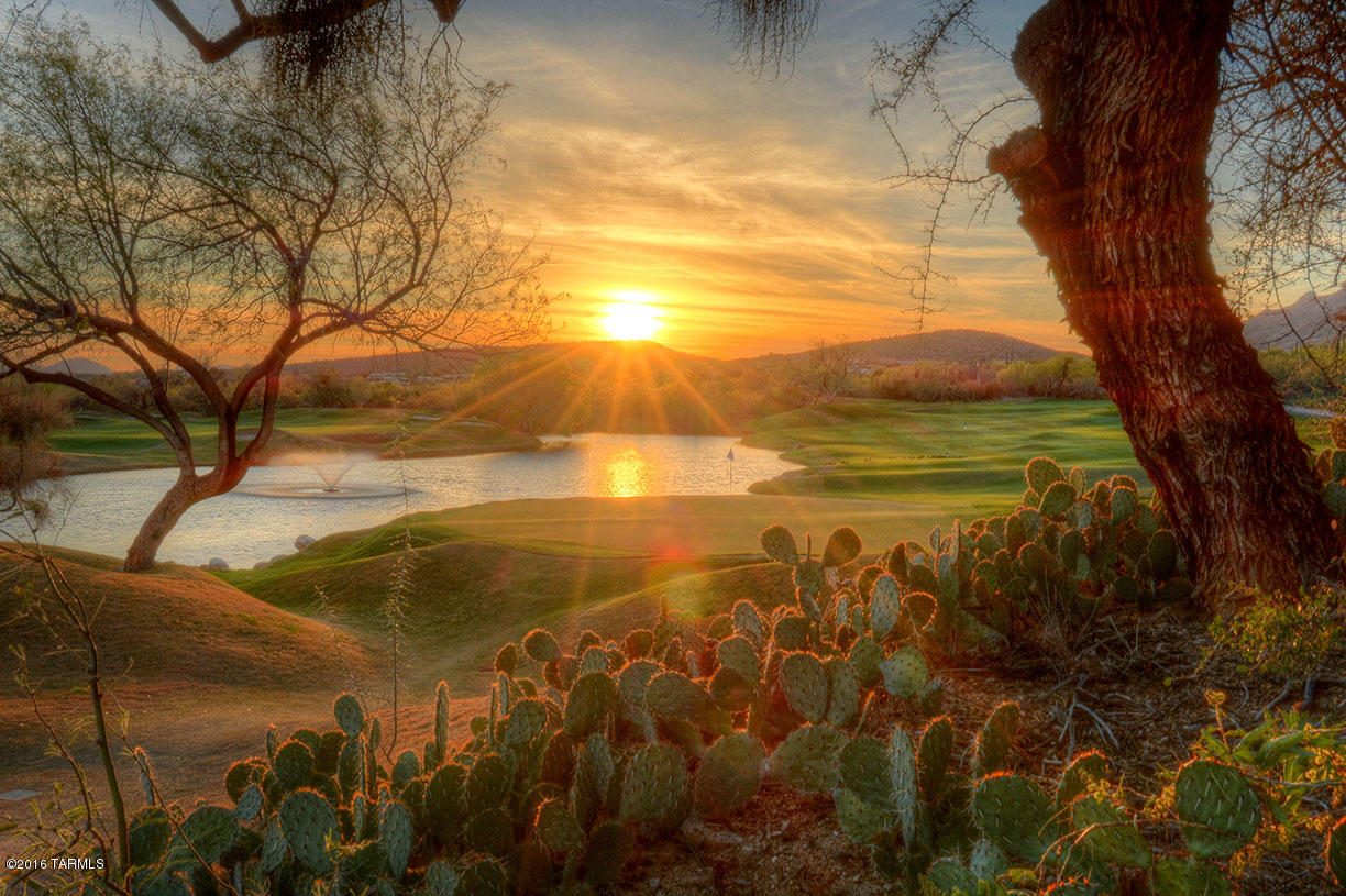 Almost the only golf course lot left in Ventana Canyon Country Club.  On the 4th hole of the Mountain Course with views of the mountain, lake and city lights. Easy to build on with homes on both sides already built.
