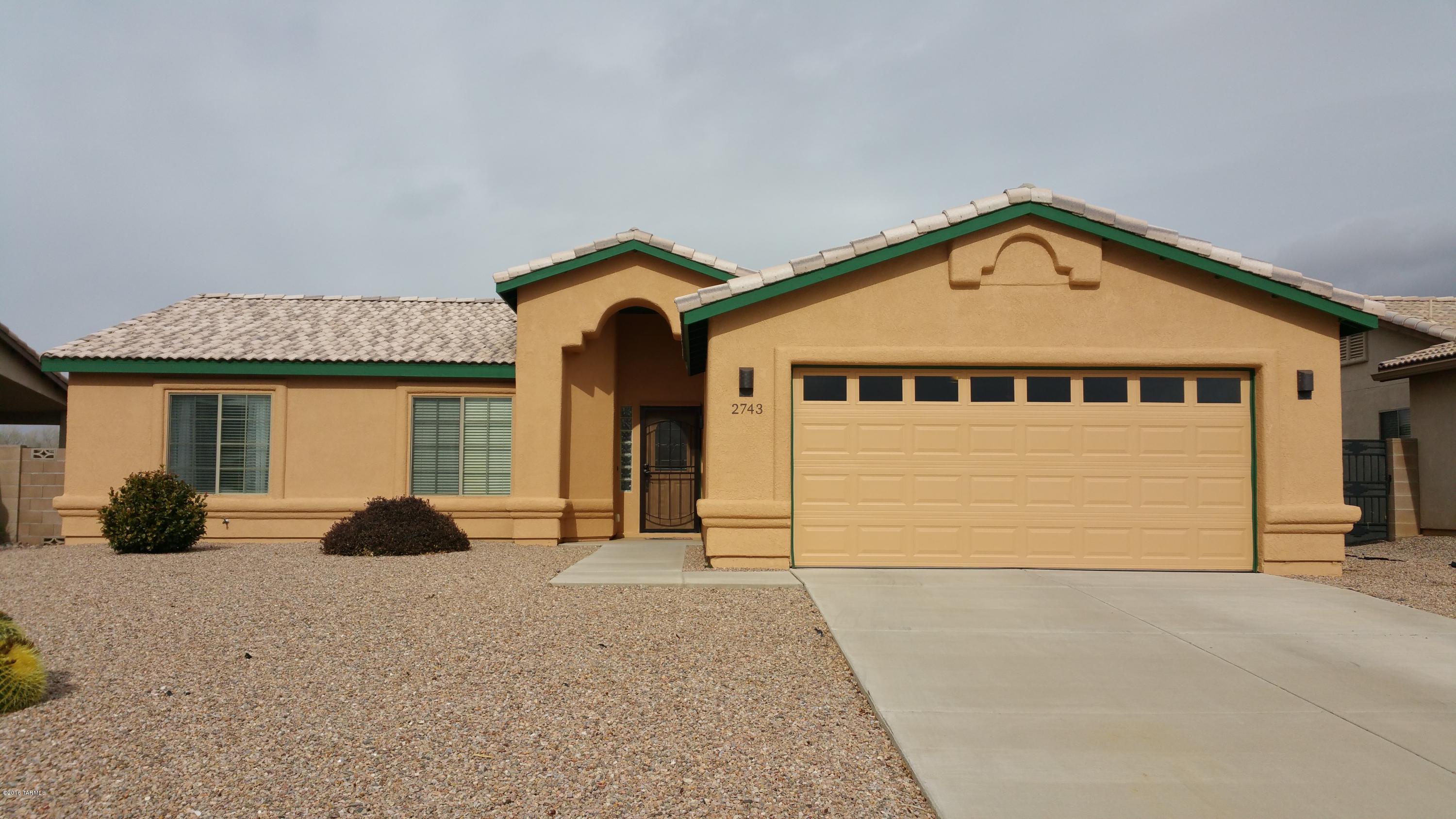 Wonderfully maintained Canyon de Flores home, freshly painted exterior, updated kitchen with solid surface countertops and pull out shelving in cabinets, new sink/faucet, new dishwasher, refrigerator, washer and dryer stay! 3 bedrooms or 2 with a den/office/ a/c, 2 car garage.  Private backyard backs up to a wash, mountain views, easy care landscaping all make this a must see home!