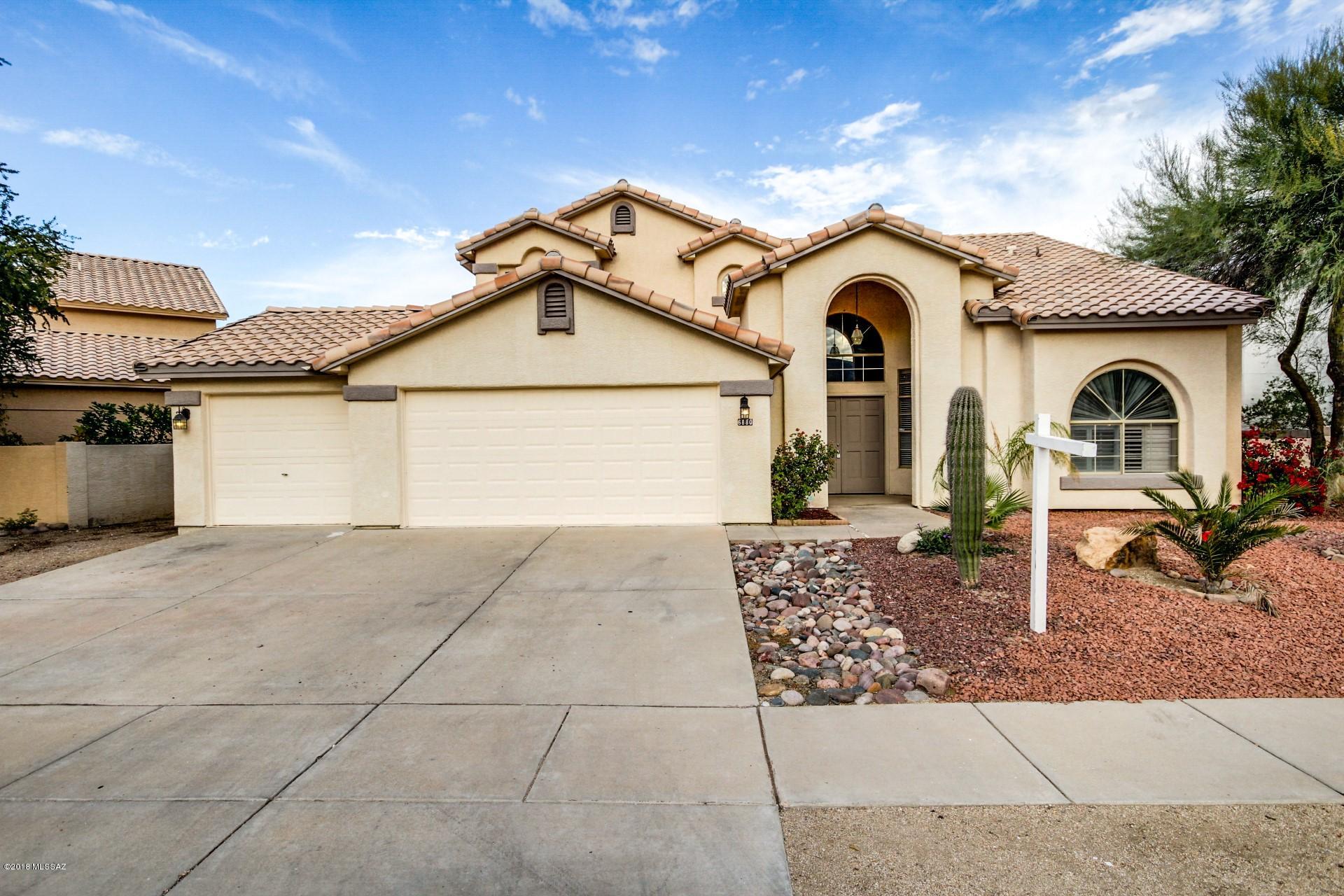 Stunning, unique and very upscale! Masterful design and modern luxury are uniquely embodied in this 4 bedroom 4 bath 2 story home with 2,781 SF. The island kitchen features granite countertops, classically white cabinetry, SS appliances and built in desk area. The home boasts stunning wood laminate and tile flooring. The sprawling staircase leads you upstairs to find spacious bedrooms that encompass high end plush carpeting. The master bathroom has an amazing garden bathtub and separate shower. The backyard showcases the pristine private pool with water feature-an ideal setting for those hot summer days! Look no further! This home is everything you've been dreaming of and more! Listing agent is related to one or more sellers.  Sellers are licensed AZ real estate agents