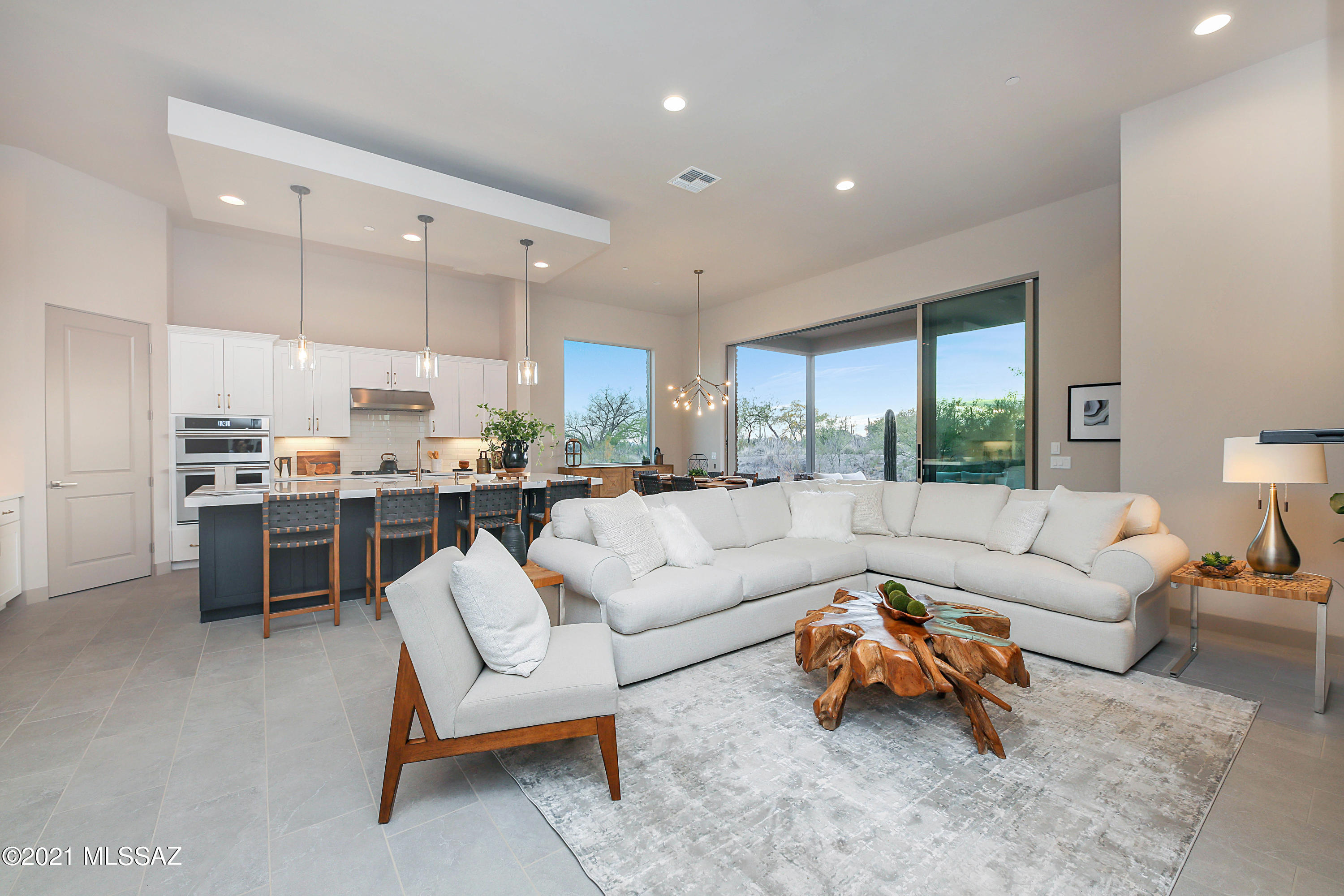 Gorgeous Brand New Contemporary Home tucked behind the gates of Stone Canyon in the coveted Enclave. Well-built by Fairfield Homes and ideally situated on the LAST available lot with a golf course view!  This sophisticated home opens up to an impressive great room with soaring 12' ceilings and 10' sliding glass doors creating the indoor/ outdoor living experience you have been looking for. Professionally designed with high end finishes and top of the line SS appliances.  Located within walking distance to the Clubhouse, Driving Range and state of the art Health and Fitness Center.