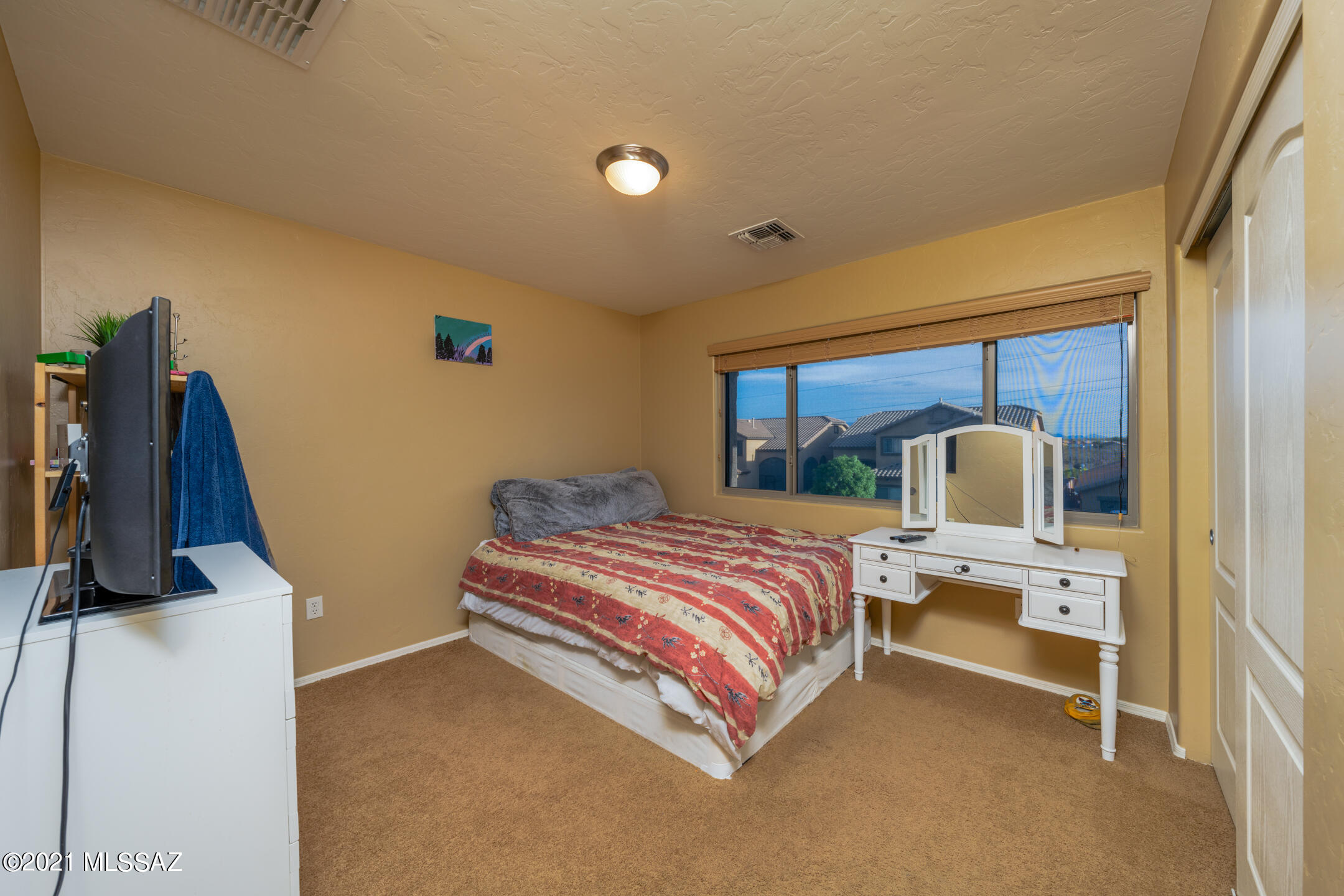 Beautiful 2-story home with gorgeous flooring and a flowing layout. Kitchen features recessed lighting, stainless steel appliances, dark stained wood cabinets, and a breakfast bar. The large primary bedroom (located on the 2nd floor) allows plenty of natural light and has a balcony where you can enjoy the views of your neighborhood in Rancho Sahuarita. Huge backyard patio is fully enclosed and includes ceiling fans. Your next chapter starts here!