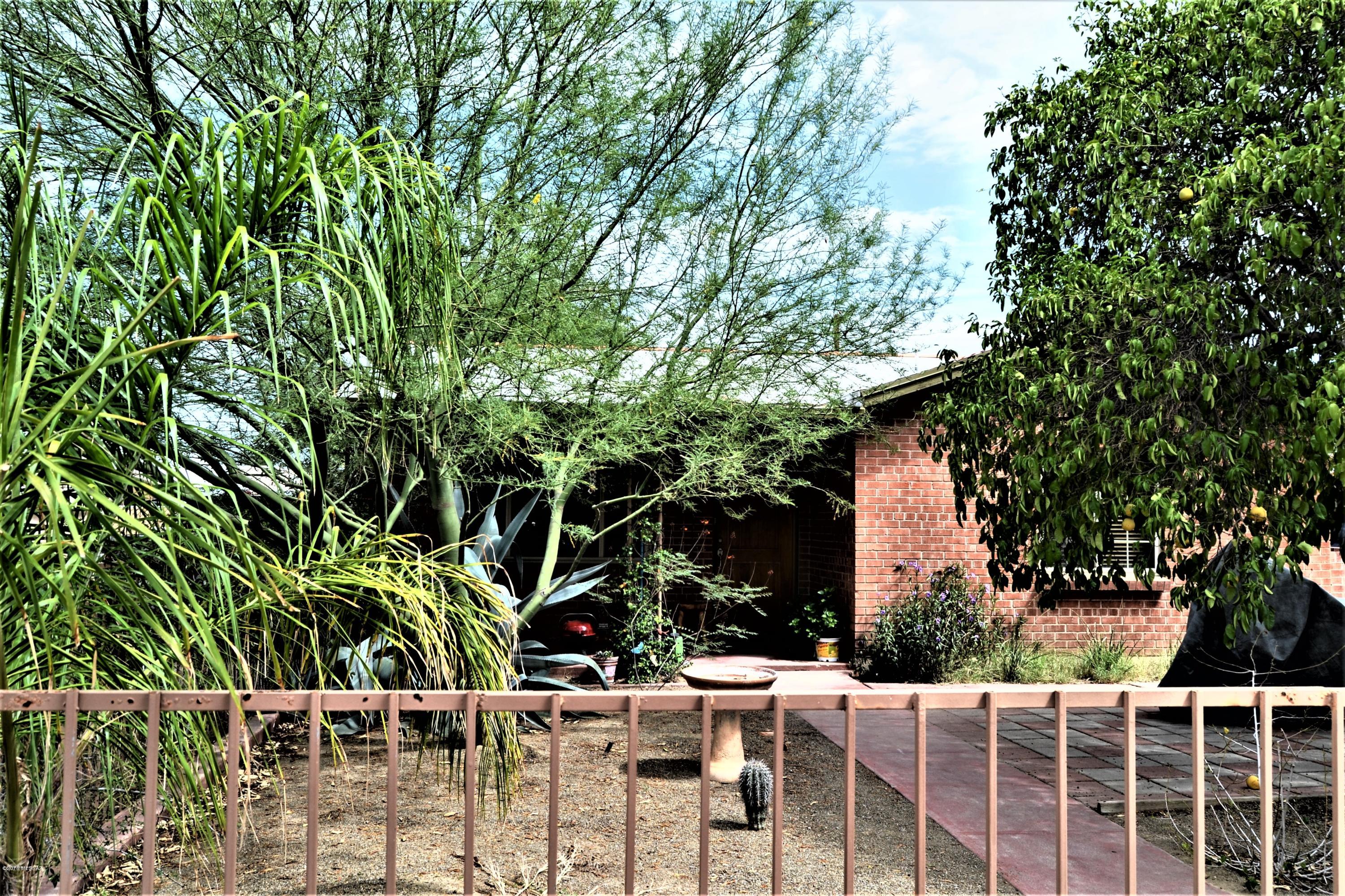 Cozy home located minutes from shopping, U of A, and Downtown. Only two blocks from Reid Park and easy access to Aviation highway. Home has Australian Cypress wood flooring with accents of tile. Kitchen boasts plenty of cabinets with a built in coffee bar, gas range, and separate pantry. The Arizona Room has plenty of windows, concrete floors, and laundry closet. Home has dual cooling and central heating. Back yard has additional storage and plenty of room to customize your very own back yard oasis.