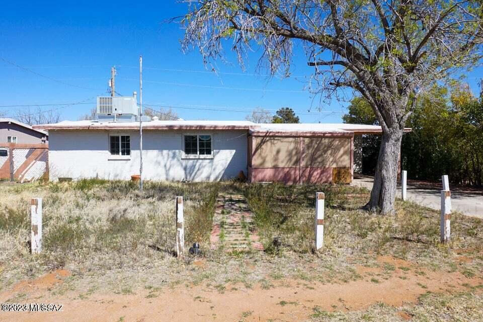 PRICED TO SELL QUICK! This home has tons of potential. 1411sf 3BD 1.5BA plus a huge BONUS room area. Newer dual pane windows
and HVAC system. Covered back patio. Workshop and shed. 2 RV gates and space to park. Front screened in porch. On a large lot located just minutes from
Fort Huachuca. Excellent first time home buyer, investment, rental or 2nd home opportunity