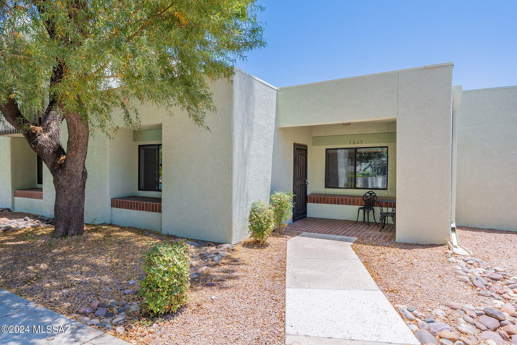Run, don't walk, to this beautifully updated NW townhouse located within the tranquil confines of La Canada Village townhomes. This 2bd - 2ba plus office melds Retro Tucson charm with modern day convenience. Built in 1985 and completely updated in 2023, this one story, 1500+Sqft, home features a chefs quality kitchen complete with all stainless appliances including induction range and smart technology refrigerator. Extended quartz counter tops and breakfast bar make meal prep and entertaining a breeze. Spacious primary bedroom has beautiful en-suite tile shower complete with double sink and bidet toilet. Office/flex room has double doors for privacy, as well as a murphy bed for guests and atrium access. Guest room has walk-in closet and private patio access. Roof recoated 2023. HVAC- 2021