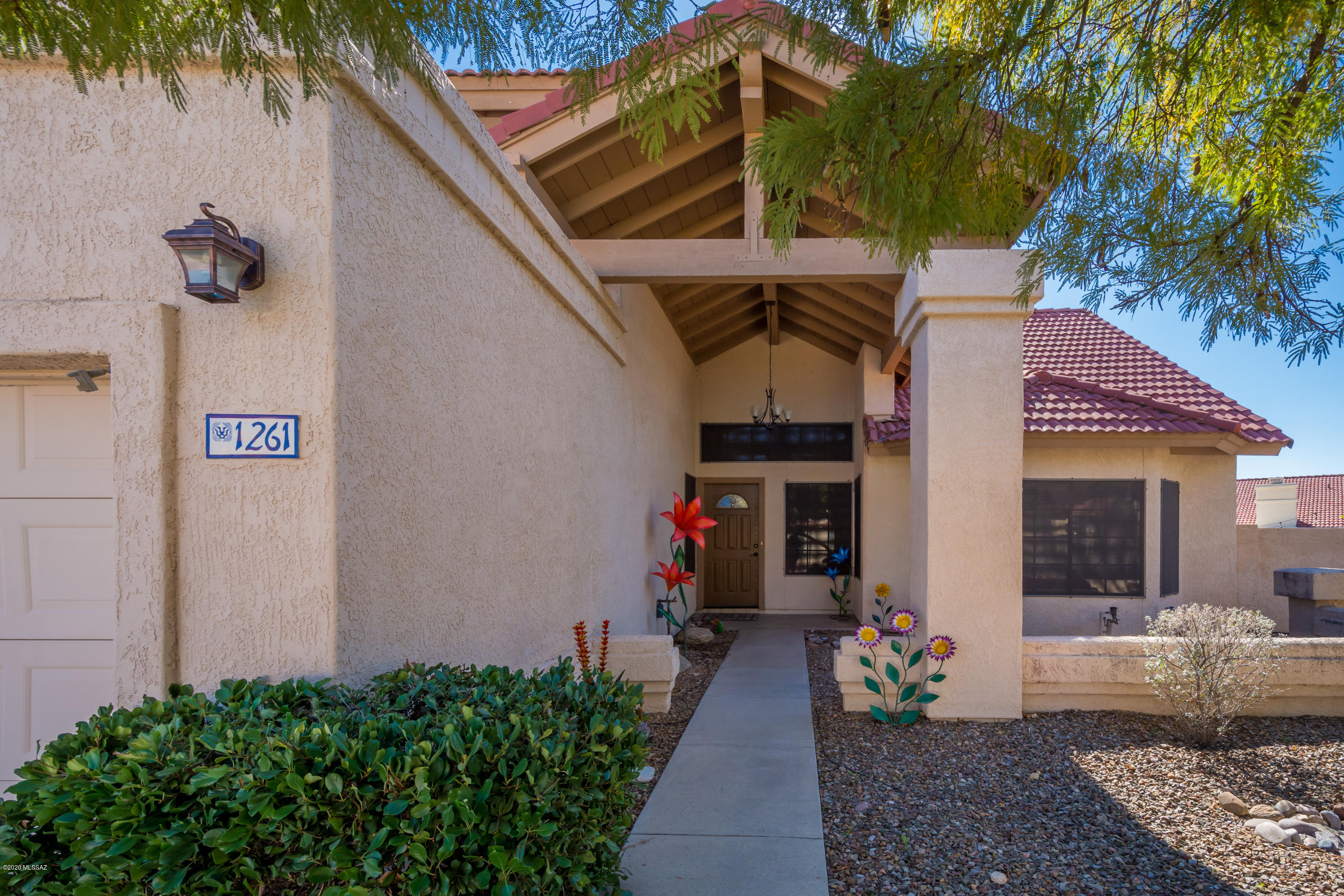 Seller Accept or counter offers $350K-360K. Perched high on a corner cul-de-sac lot, this Beautifully updated, well maintained 5Bdr 3bth Copper Creek home welcomes you w/ soaring ceilings, rich cherry wood flooring, open floor plan & so much more!  Guests coming?...no problem..1 bdr and 1 full bth on the 1st floor. You'll be wowed by the Chef size kitchen w/ stunning new granite slab counters making cooking a delight. Stressed out?... Relax on your  back patio and let the green vegetation & the magnificence of your Pusch Ridge View calm you!. Or sunbathe in your private serene pool yd  w/ fruit bearing citrus and fig trees!  NO poly pipes..Both AC systems recently replaced..AND $30K worth of SOLAR PANELS are paid for and yours...count those savings!!  This home is a beauty Inside and out