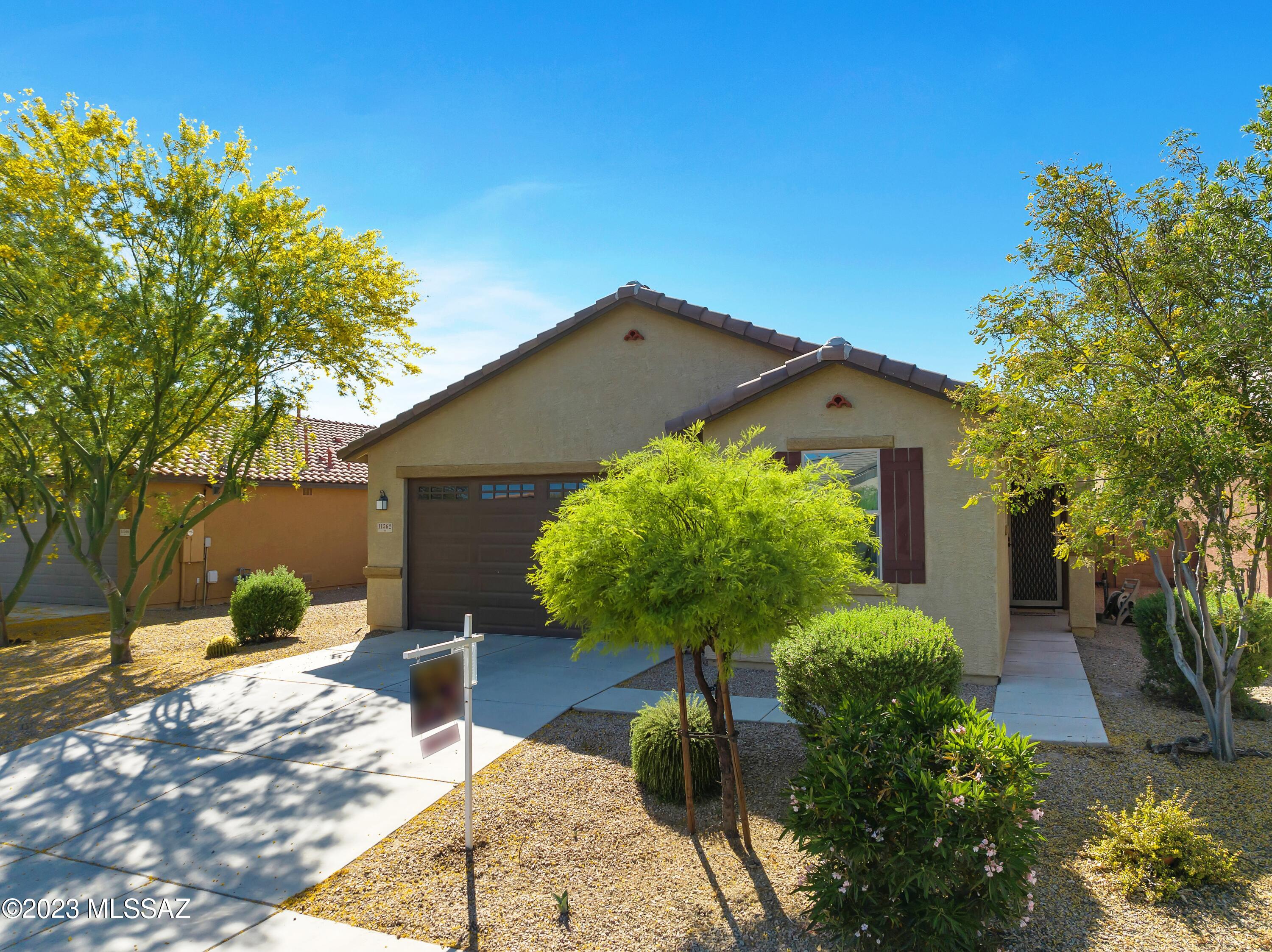 This beautiful home is within walking distance of Gladden Farms Elementary School. Spacious and contemporary, this home has 4 bedrooms and 2 full baths. The open concept gives you just the space you are looking for to spend time with those you love. The backyard is private, and the patio has automatic sunscreens to provide a cozy space to enjoy our Southern Arizona evenings.
Gladden Farms has a very active Community Organization along with the Marana Parks and Rec. Dept.  Whether it's Easter Egg Hunts, planting classes at Heritage Park, or time at the baseball/soccer fields and splash pad, Gladden Farms is designed for family activities.  With miles and miles of paved walking paths that cut throughout the community the open space is abundant. Truly a place to call home and make loving memories for years to come!