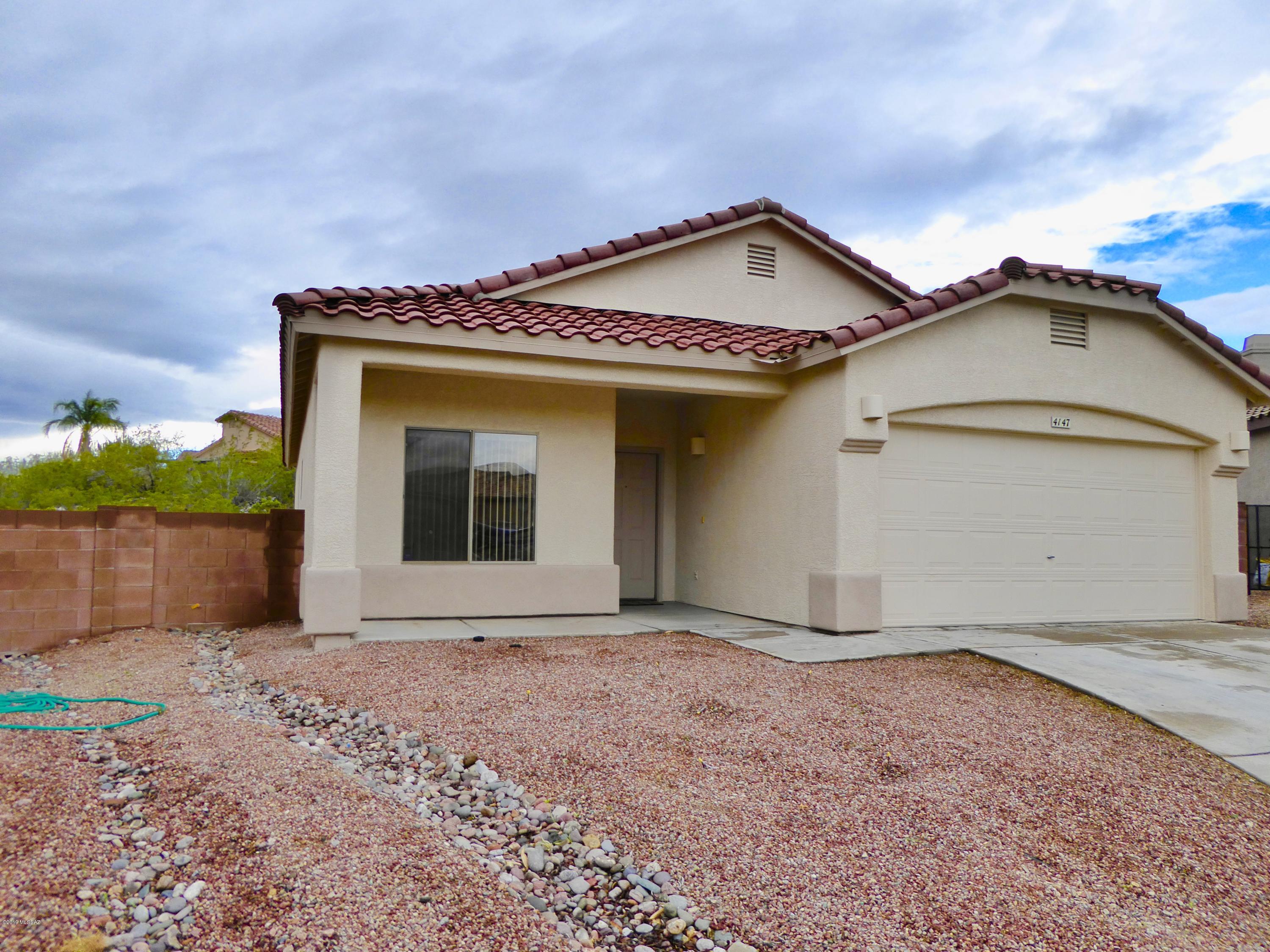 Original Owner Home in quiet gated subdivision in the Tucson Mt Foothills. Premium cul-de-sac lot. Kitchen opens to the Great Room. Vaulted ceilings. Split floor plan. Ceiling fans, plant shelves. Master bath has separate shower & tub. Washer and Dryer. Well maintained. Large rear pool-sized yard, ready for your landscaping ideas. Home backs to Common area. Complete Exterior of the Home just professionally painted! Shelving in garage can stay. A must see!