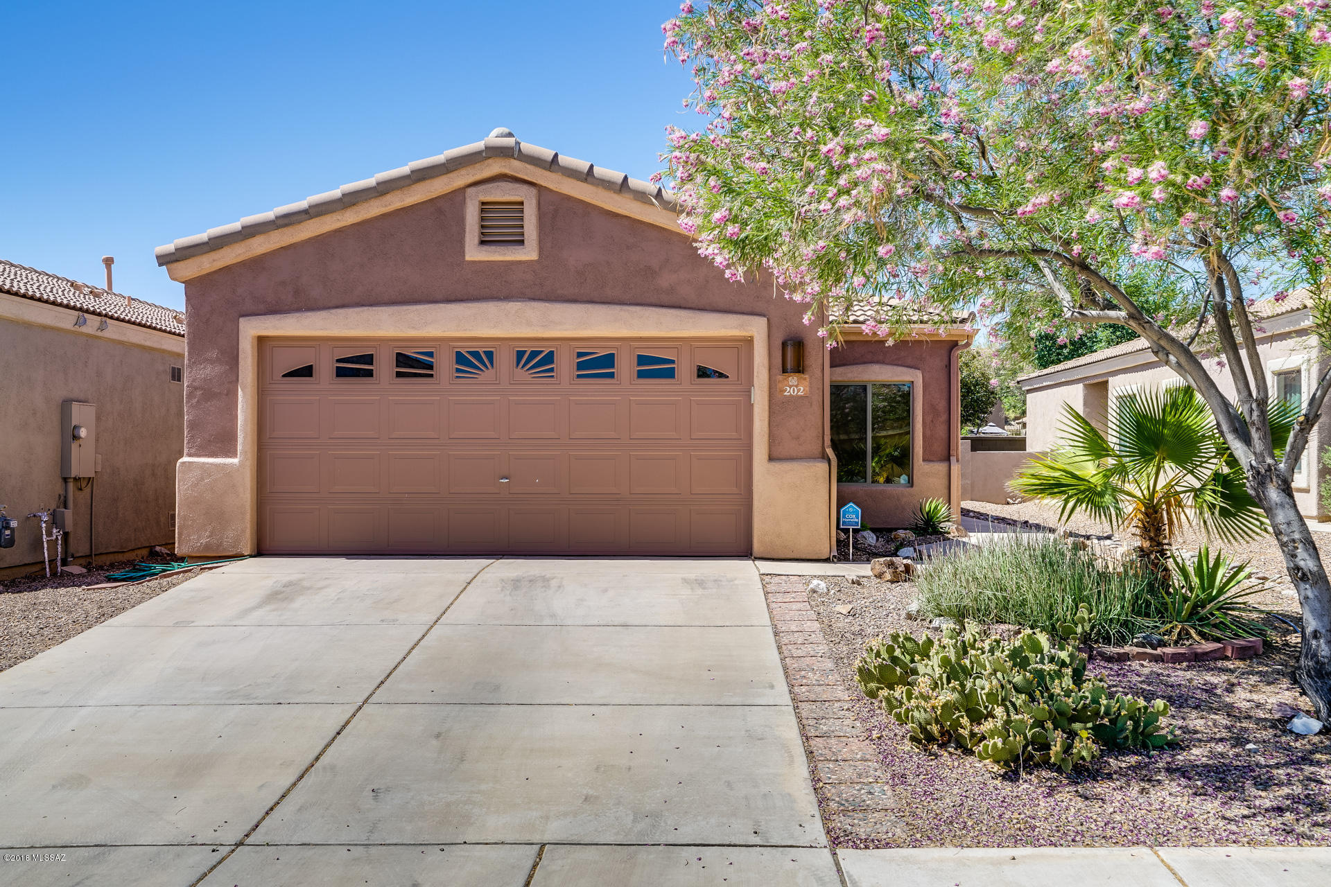 This lovely little house is located in the resort community of Rancho Sahuarita.  It is nestled one block form the local park and 3 blocks from the lake.  Your home is one of the rare homes with no rear neighbor.  It features tile throughout the home a low maintenance landscaped backyard and a large kitchen.  The exterior of the home was recently painted and the Southwest themed security door lets the air in while maintaining your privacy and security.  It's just a question of when you want your keys.