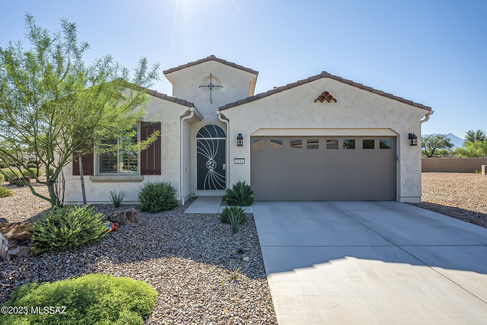 A Quail Creek Villa on a Standalone 6,108 sf lot, Beautifully Furnished & with a Club Car Golf Cart included - YES!  This Unique Villa built in 2021 comes with Builder Warranties in effect. You will love this Ocotillo Split-Bedroom Floor Plan with a Kitchen Island, Quartz Countertops, Upgraded Lighting & Under Cabinet Lighting, SS GE Profile Appliances and Bosch Refrigerator, Wine Cooler in the Laundry Room w/extra Cabinets, Plantation Shutters t/o and a Bonus Powerview Luminette shade in the Great Room.  Electric shades on the patio also provide convenience and privacy.  The Den Desk Cabinetry was built by Durazo Woodworks and the Primary Bedroom comes with a Custom Classy Closet.  Are you ready for Sunrise and Sunset Mountain Views?  This home is Immaculate and Move-In Ready