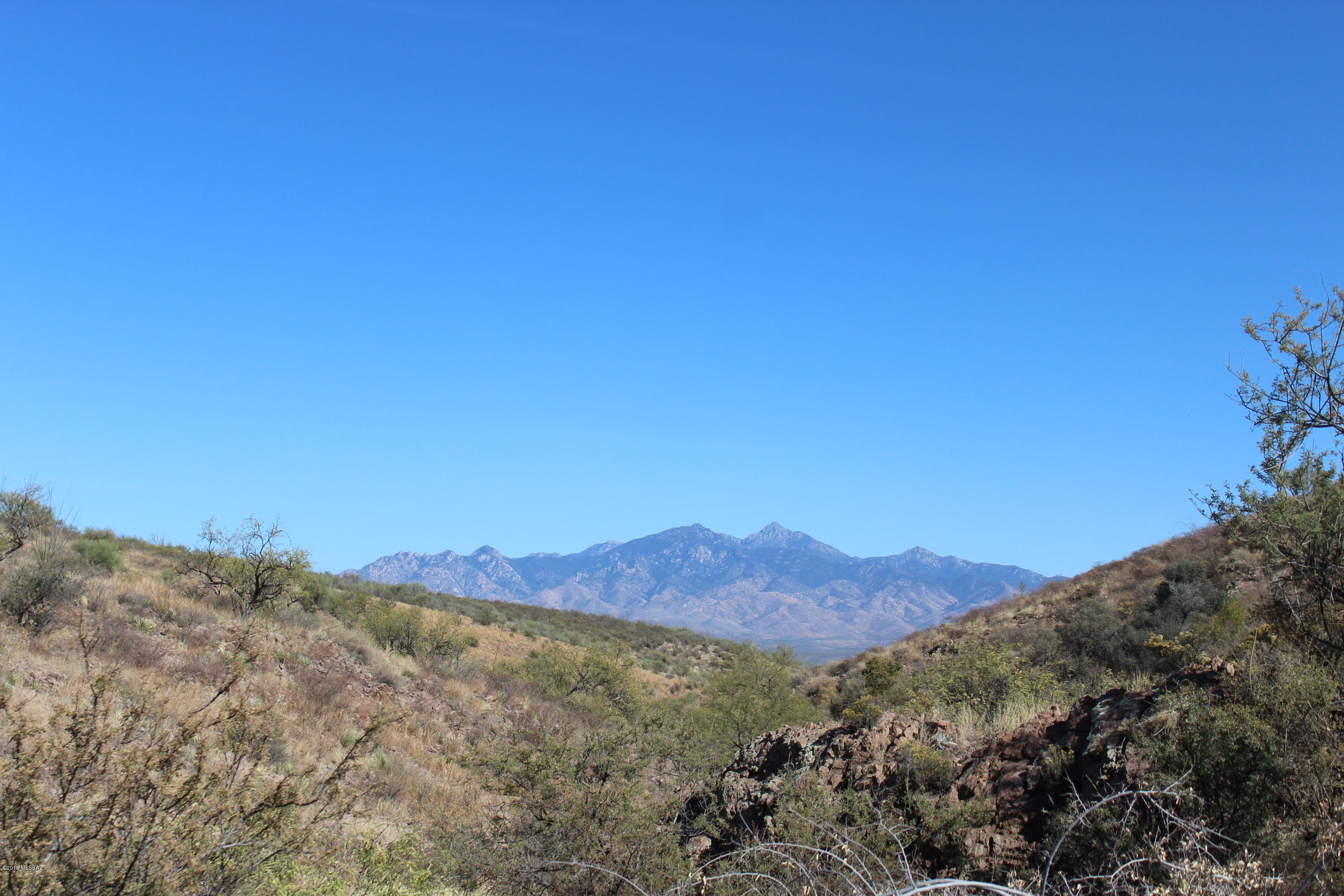 Beautiful 20.95 acre parcel nestled in the heart of Aliso Springs in Tubac, Arizona.  This parcel has fabulous views of the surrounding mountains and national forest to the west, as well as of the Santa Rita mountains towering to over 10,000 in the east.  The property extends into a beautiful canyon with interesting rock and landscape formations.  Schedule an appointment to tour this property!  You will not be disappointed.