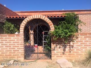 On the south end of the Tubac Valley Country Club Estates is this burnt adobe home on a 3/4 acre lot. The 3 bedroom, 2 bath home has an east facing patio so you can enjoy the pool and the mountain views.