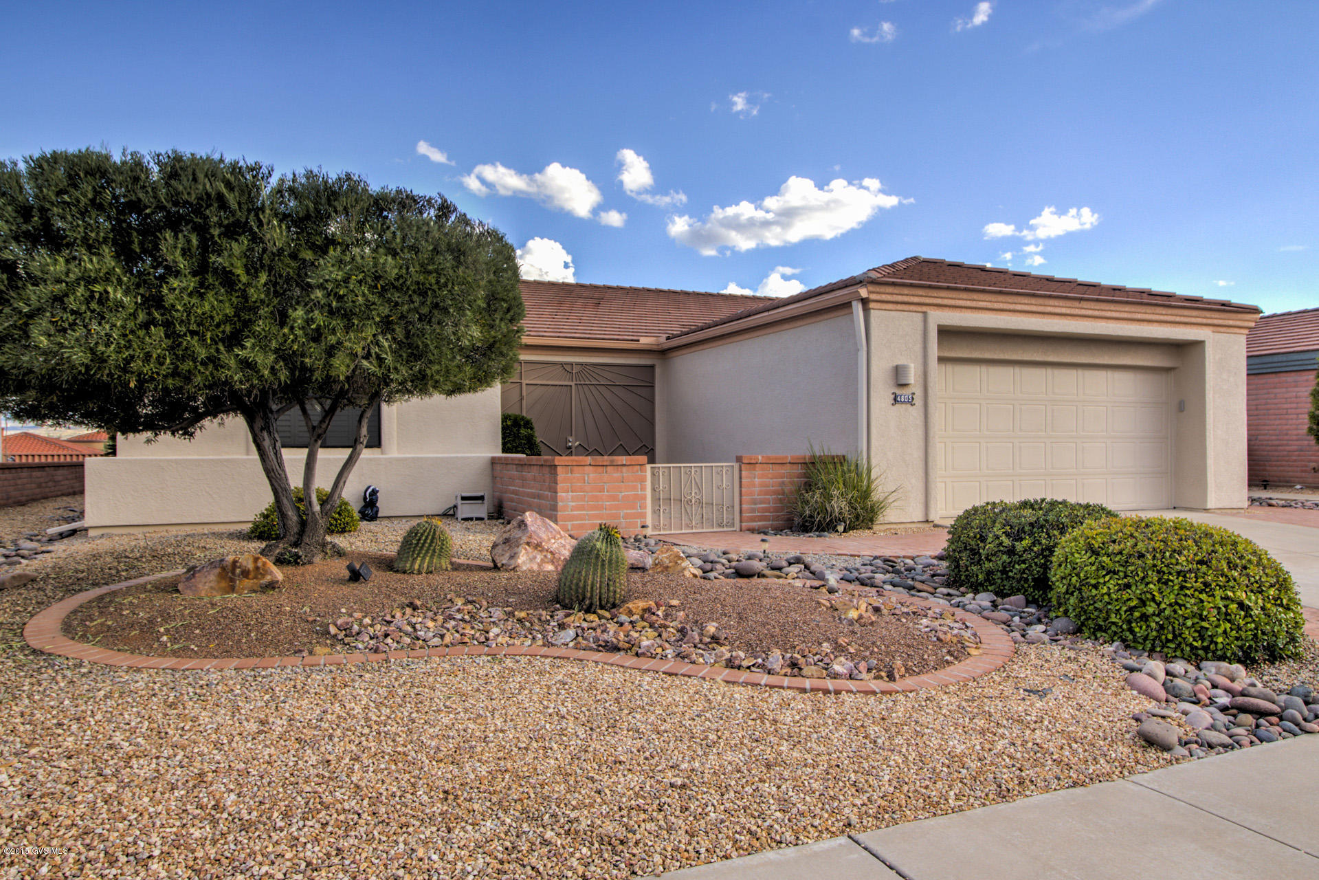 The panoramic Green Valley Mountain View everyone wants! And a lovely home to go with it! Lots of windows to let in natural light and to enjoy the view from almost every room. Great Room has Gas log fireplace, plant shelves, lighted niches and vaulted ceilings. Kitchen is off the great room area and has gorgeous granite countertops, under cabinet lighting, and stainless appliances. There is both a Den and an extra office area. Covered patio in back is screened in. Home is all tiled, features upgraded window treatments, and is immaculate!
 
 Note: Office area still has washer/dryer hook-ups should anyone want to move the laundry back inside the house.