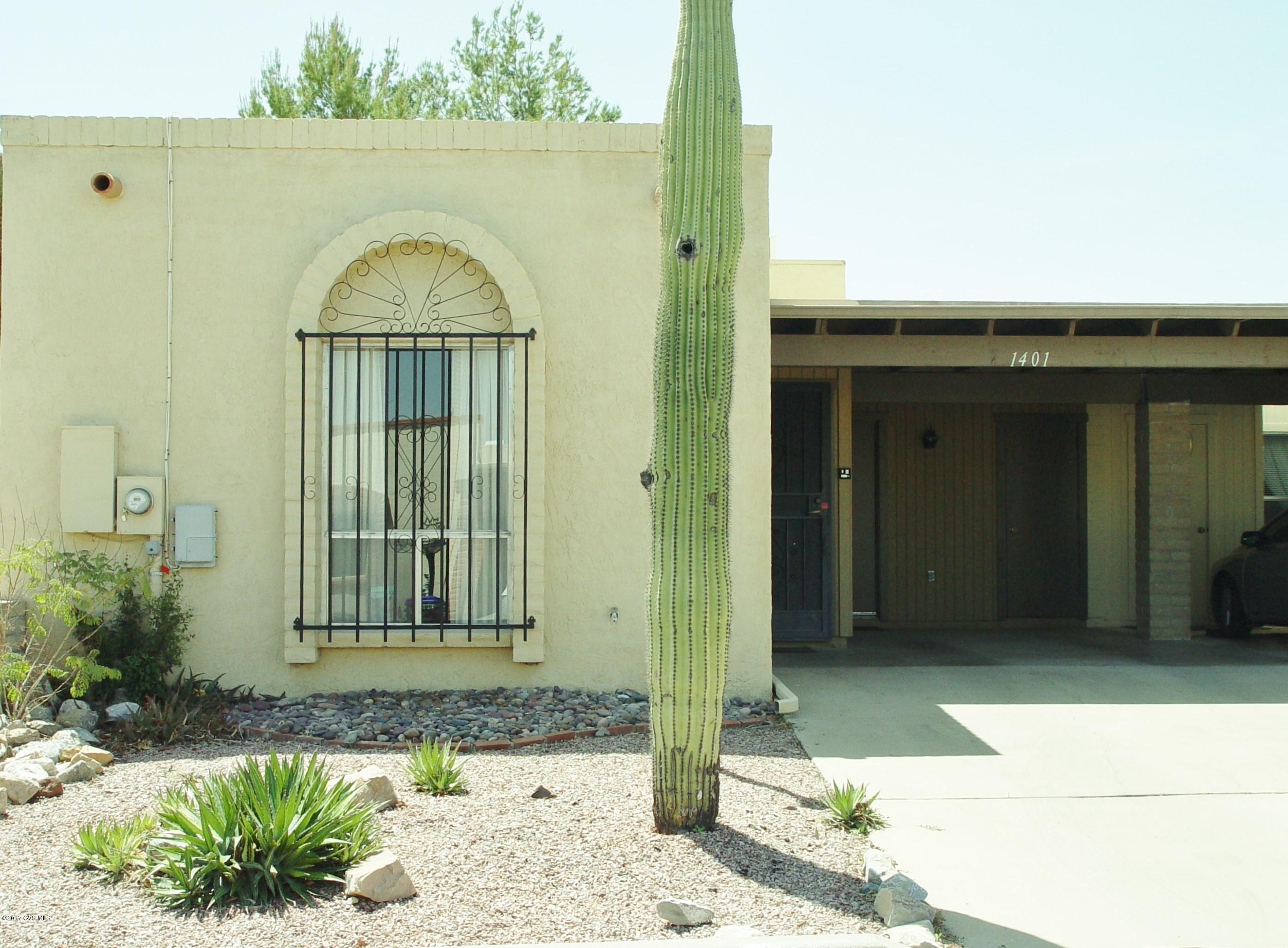 You will appreciate this townhome in popular Desert Hills II that has so many good features. It has large tile throughout the living areas which puts it way ahead of many other homes. It has extra square footage with an enclosed Arizona room that can be used for whatever you need an extra space for-a den, an office, or a hobby room. You get a peekaboo view of the Santa Ritas from the back patio that backs up to common space. It is close to golf at the Desert Hills Country Club and the Desert Hills Rec Center, one of the nicest rec centers in Green Valley. The home is in great shape and is move-in ready with the furniture also included at no extra cost with the sale of the property. And its own saguaro in the front yard! Come visit today.