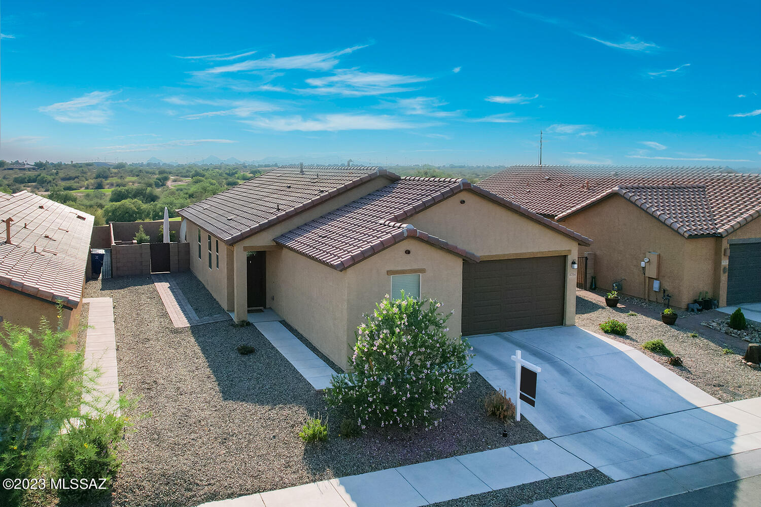 Welcome home! Built in 2021 located in Bella Tierra. Conveniently close to a golf course, walking trails, parks, schools, Davis-Monthan Air Force Base and easy access to I-10. Step inside and prepare to be impressed by the well-appointed kitchen with quartz countertops, a large kitchen island, timeless backsplash, and soft close drawers. Home features also include 3 bedrooms plus a den, split floor plan, upgraded carpet, 8x24 tile, 9' ceilings, modern fixtures, water softener, smart thermostat, smart lighting and custom two-tone paint throughout. The backyard is a true oasis with custom pavers, Tuff shed, gas connection for your BBQ Grill, planted trees and no neighbors behind. For your peace of mind, this home is still under a 10-year limited warranty. See additional documents.