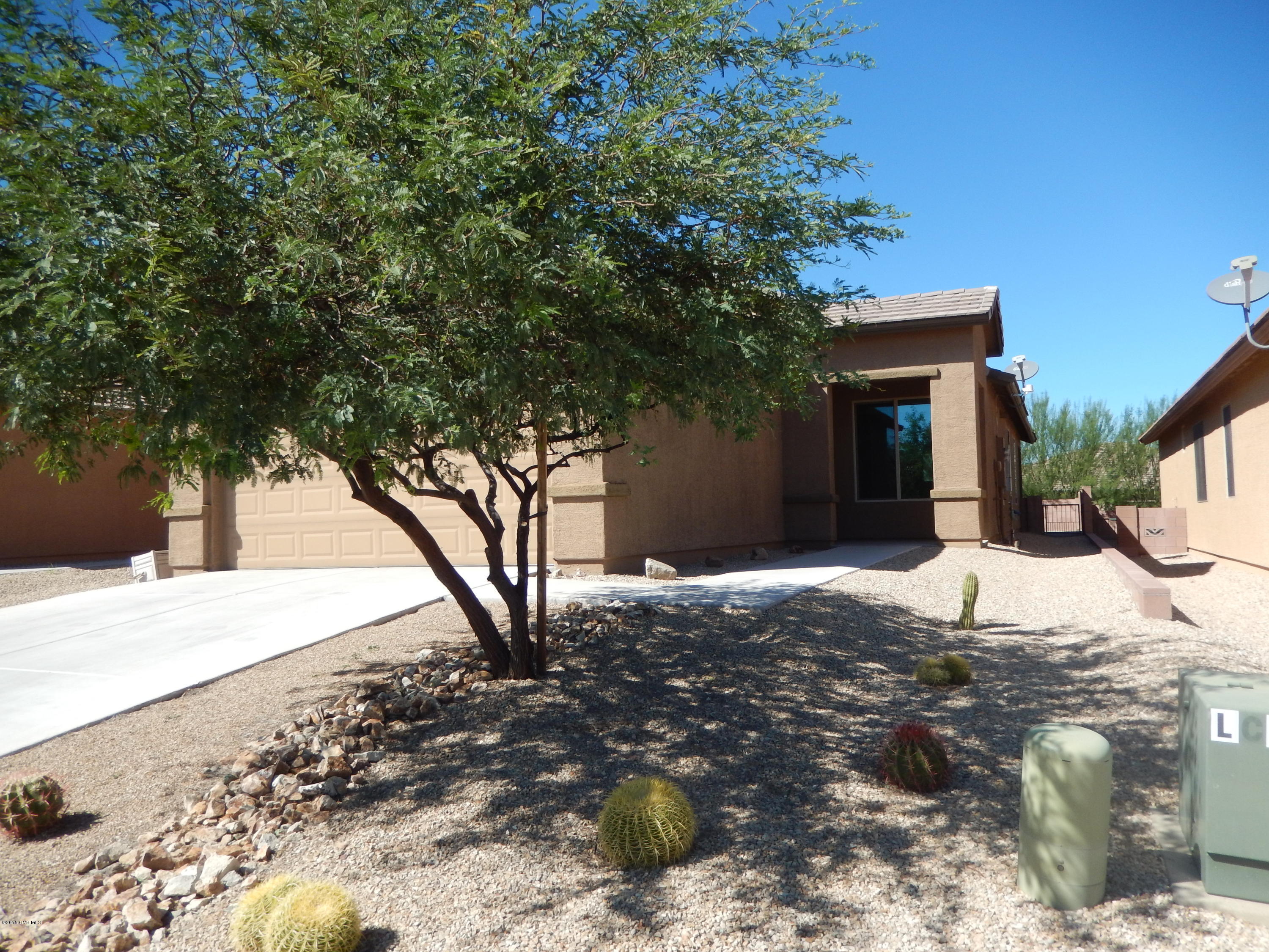 Enjoy this ''Moonlight'' model with 2 bedrooms plus den. All tile floors with large master suite which includes area for exercise, reading, or extra storage. The kitchen has corian counter tops, double oven, and breakfast nook. All windows have the honeycomb blinds. The solar panels are owned and will transfer with the sale.